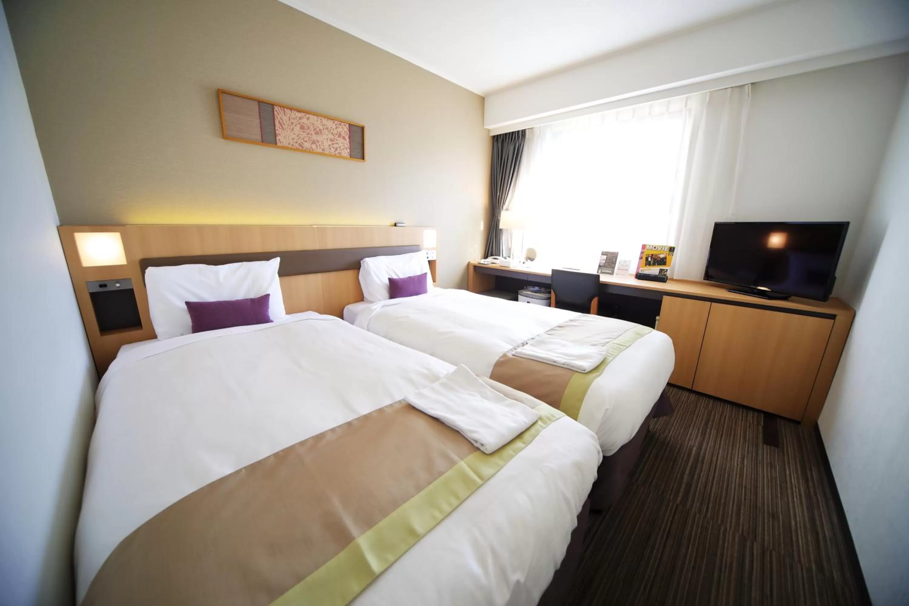 Bed in Hotel Sunroute Asakusa