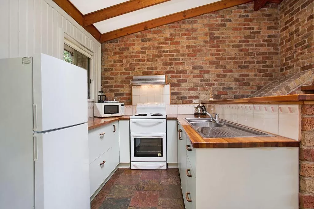 Communal kitchen in Beacon Point Ocean View Villas