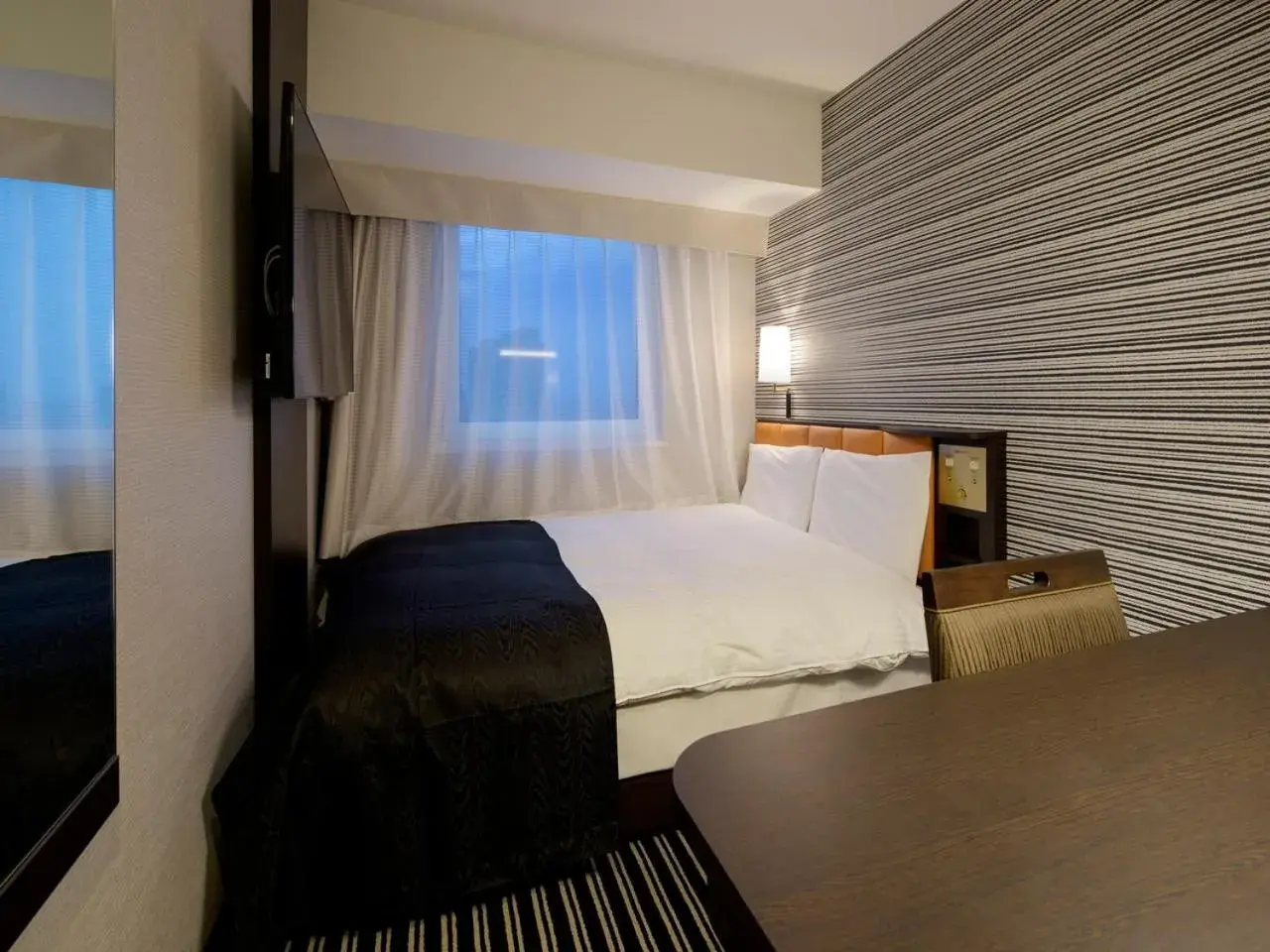 Photo of the whole room, Bed in Apa Hotel Shinjuku-Kabukicho Tower