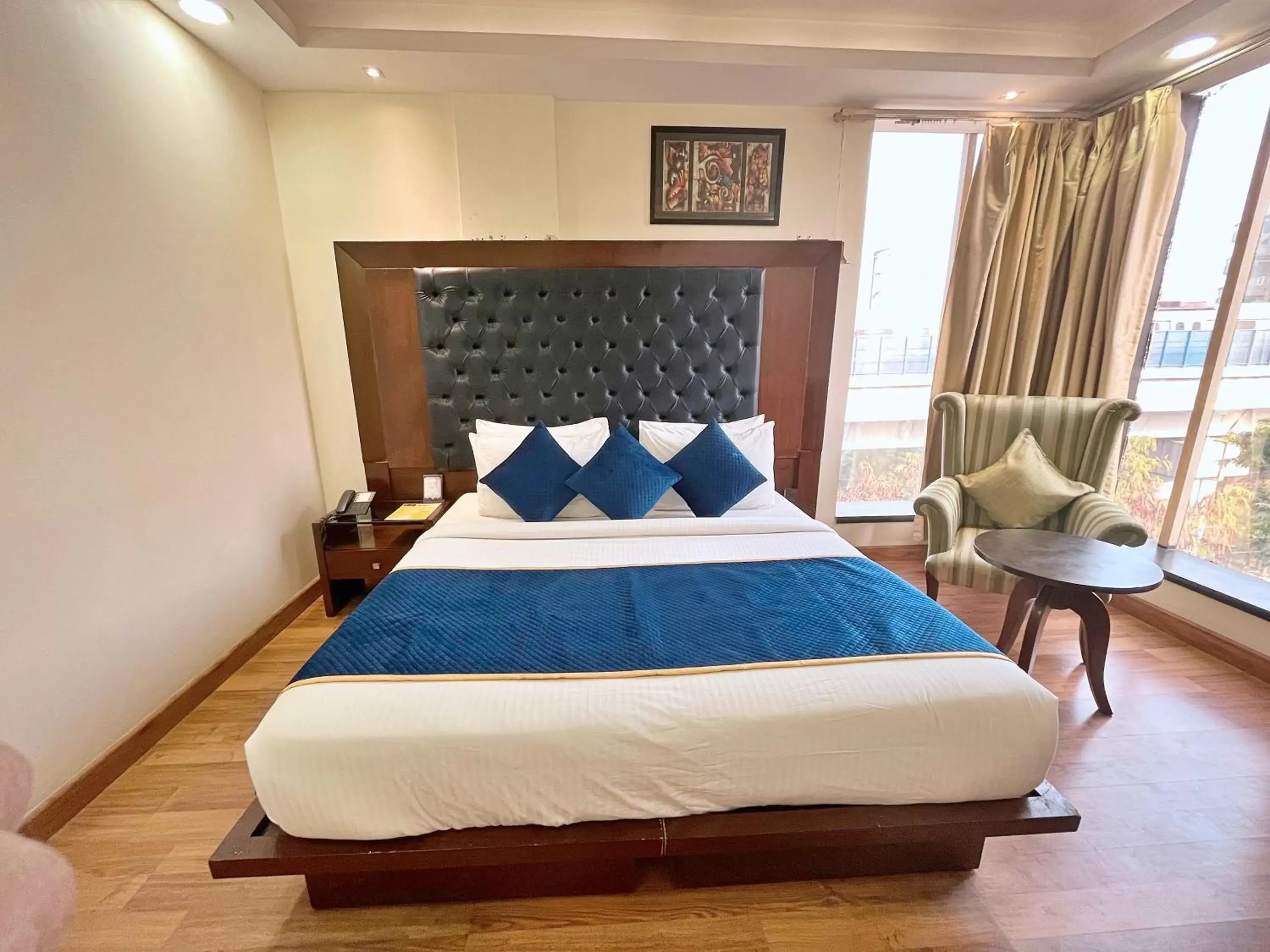 Photo of the whole room, Bed in The Grand Orion - Kailash Colony