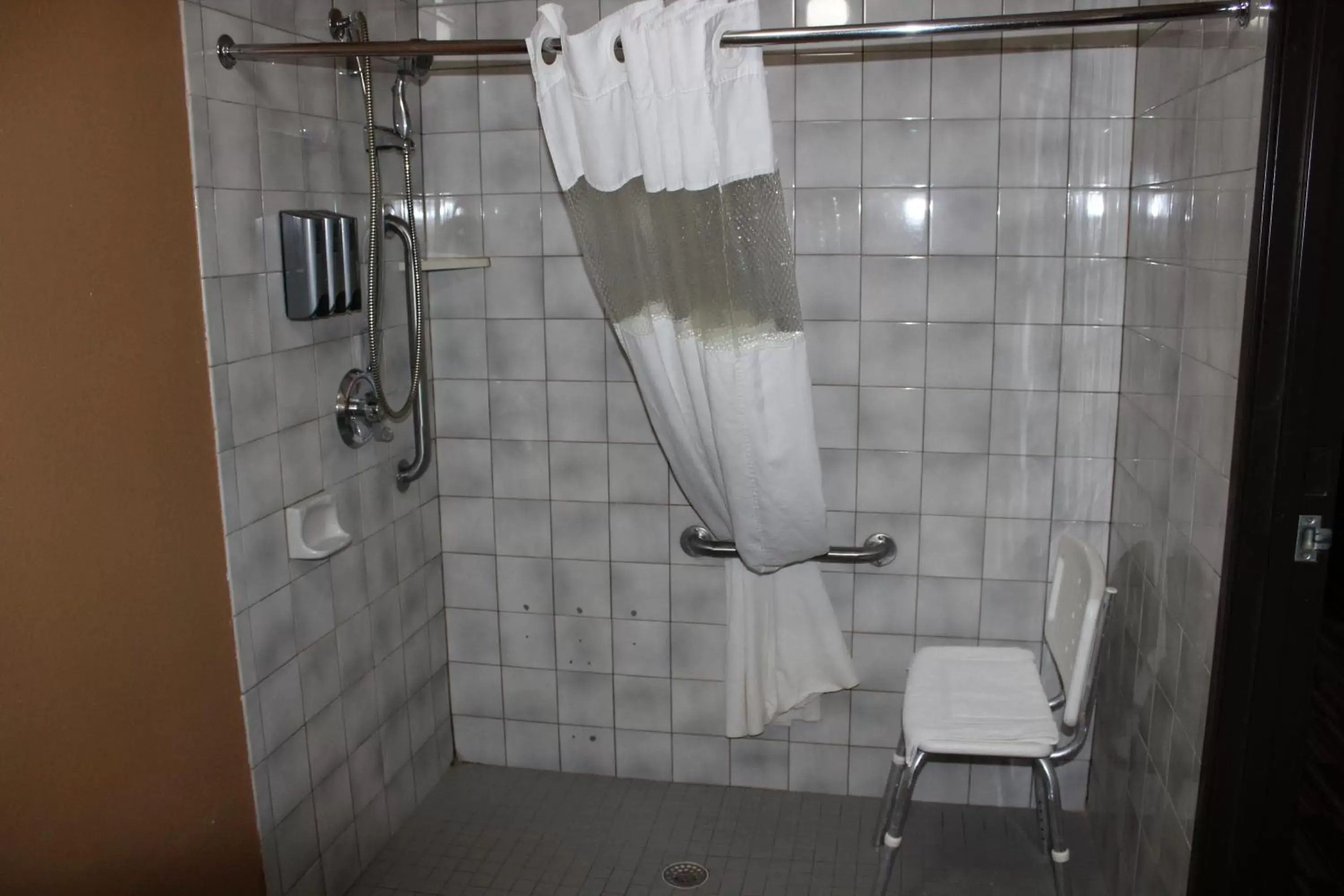 Shower, Bathroom in Coratel Inn and Suites Maple Grove