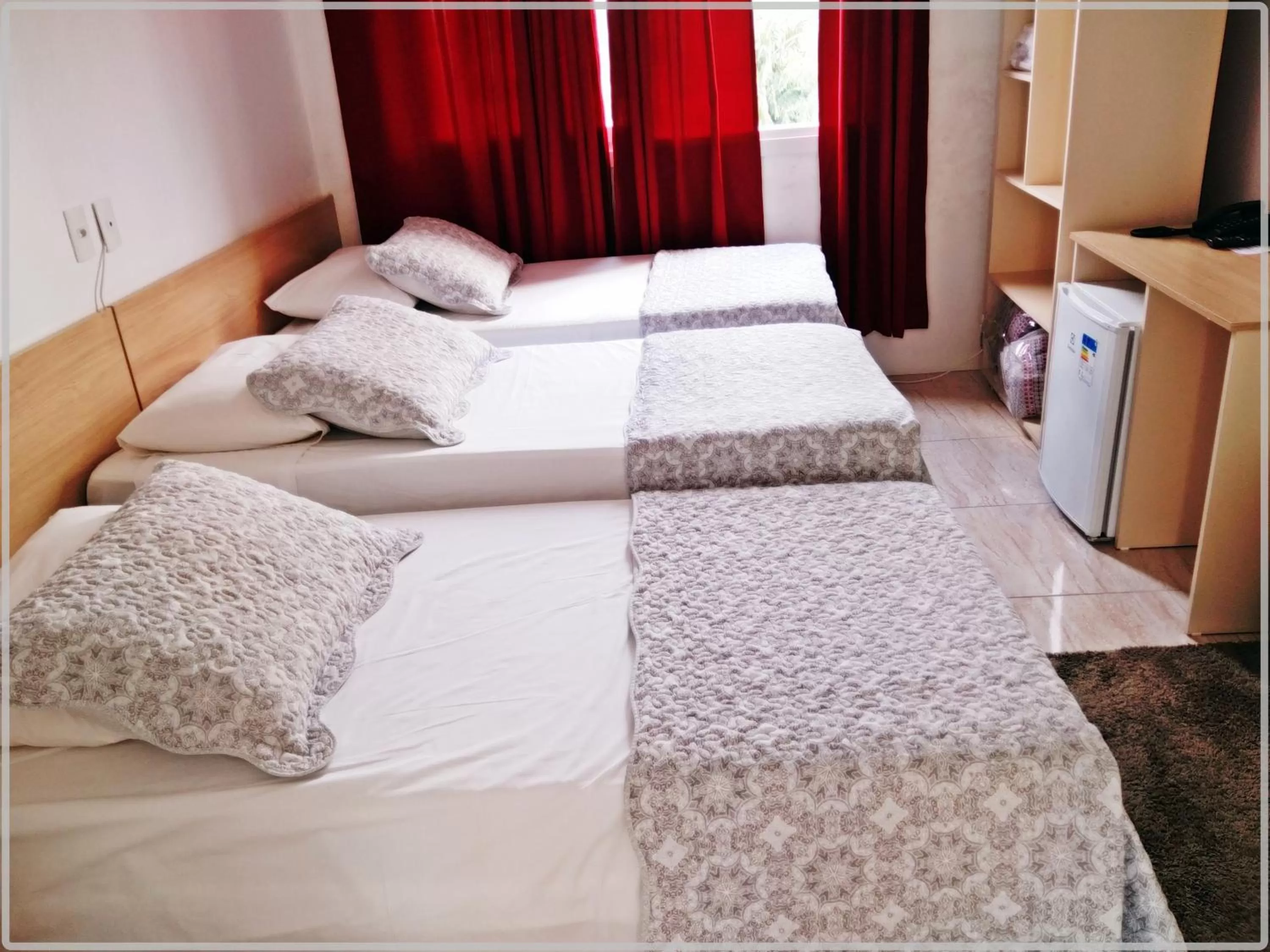 Bed in Hotel Anjos LTDA