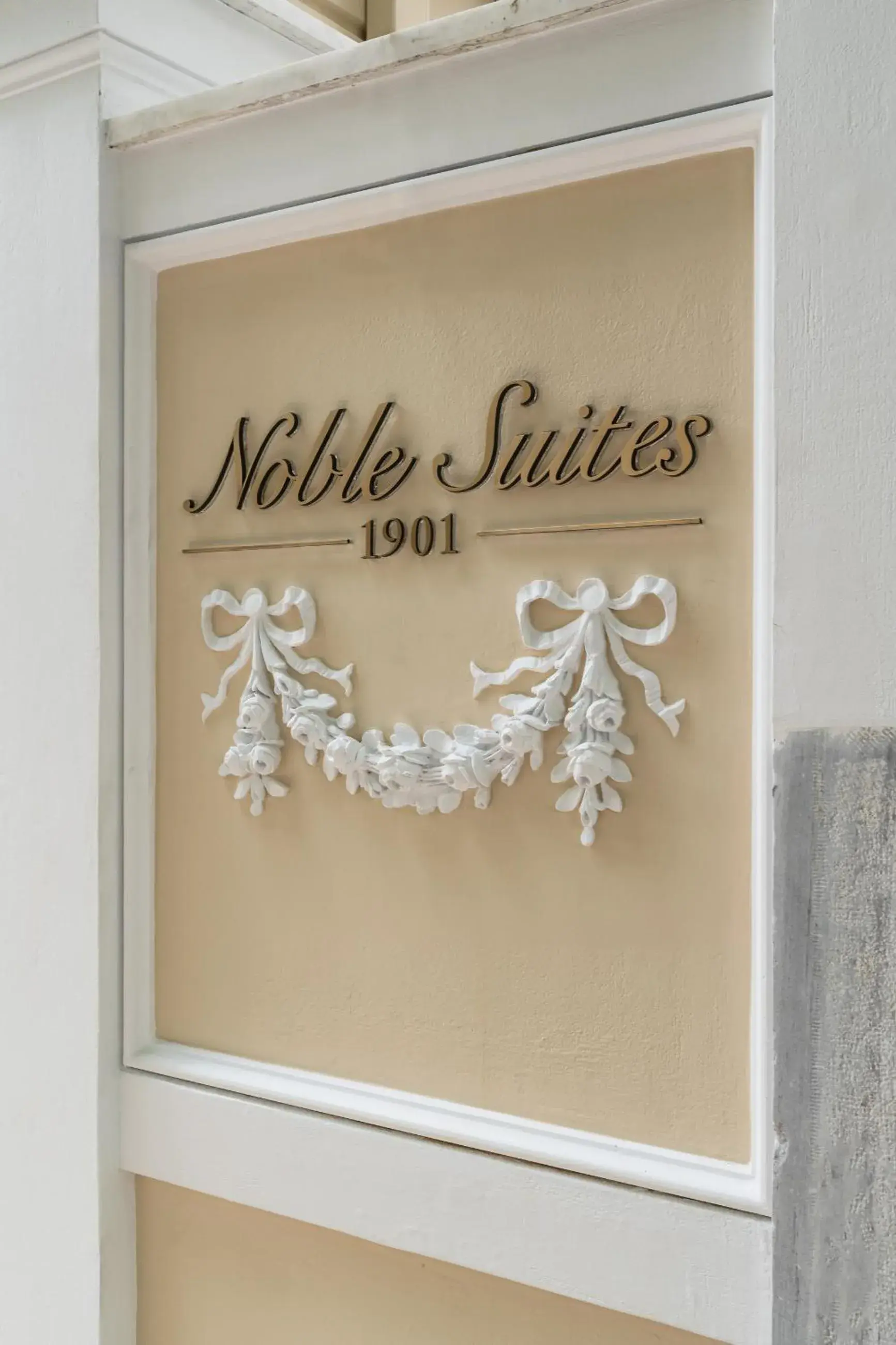 Property logo or sign in Noble Suites