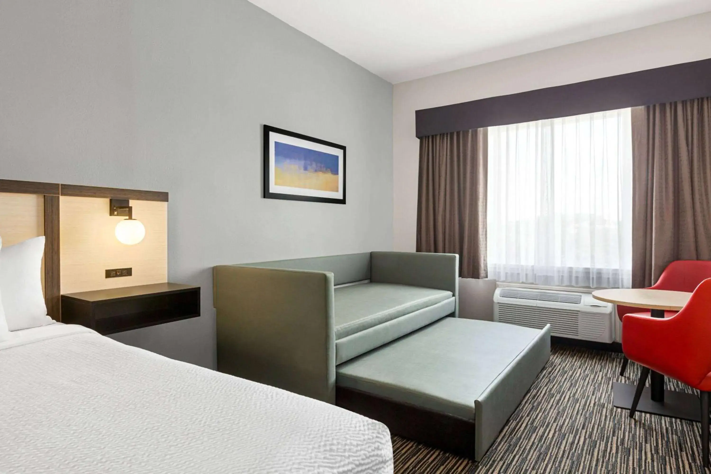 Bed, Seating Area in Ramada by Wyndham Marina