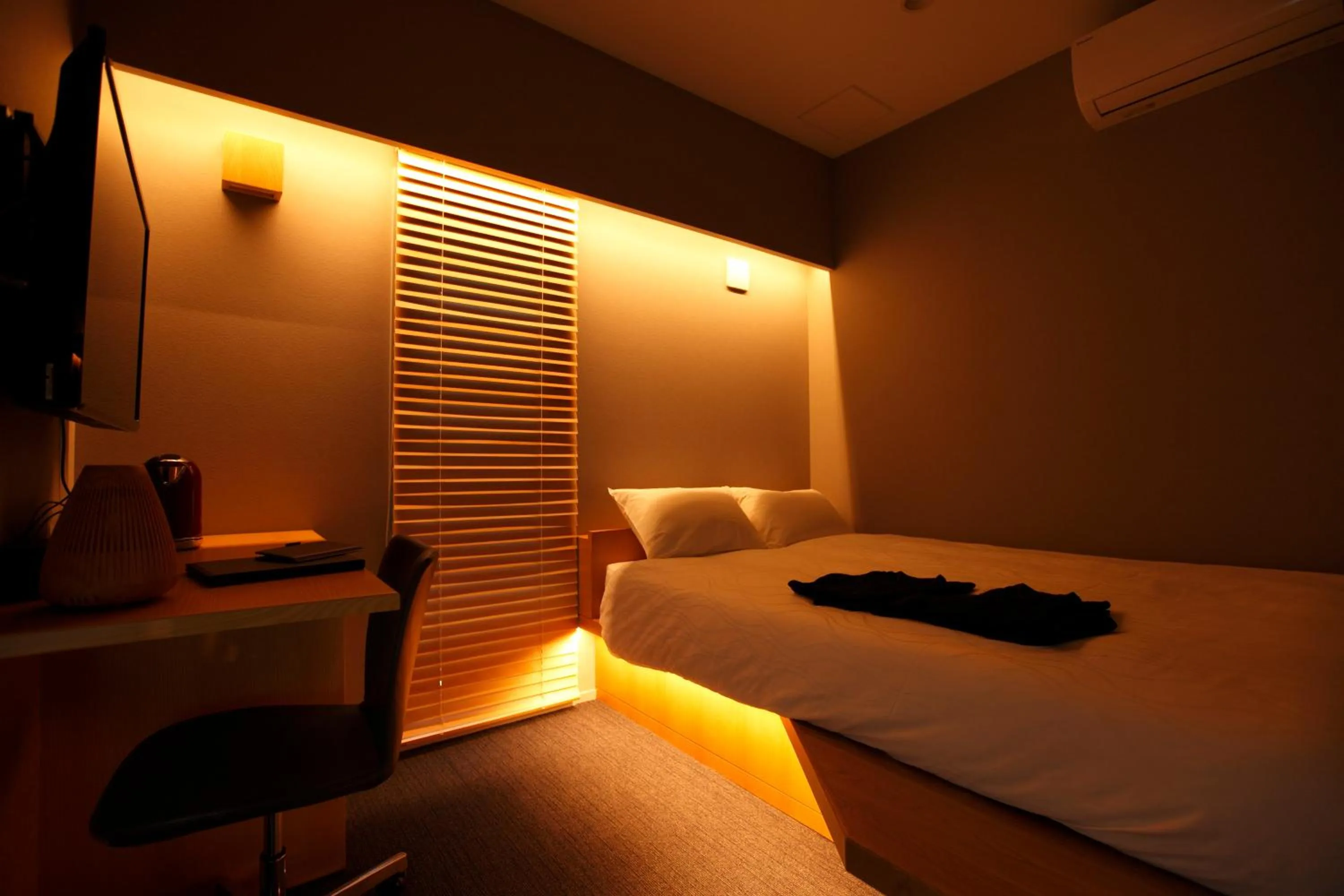 Bed in HOTEL AMANEK Ginza East