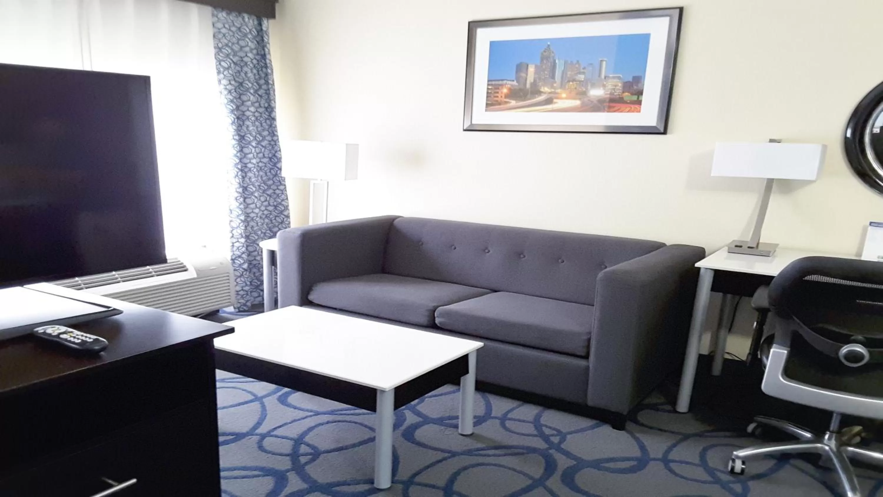 Communal lounge/ TV room in Holiday Inn Express Hotel & Suites Lawrenceville by IHG
