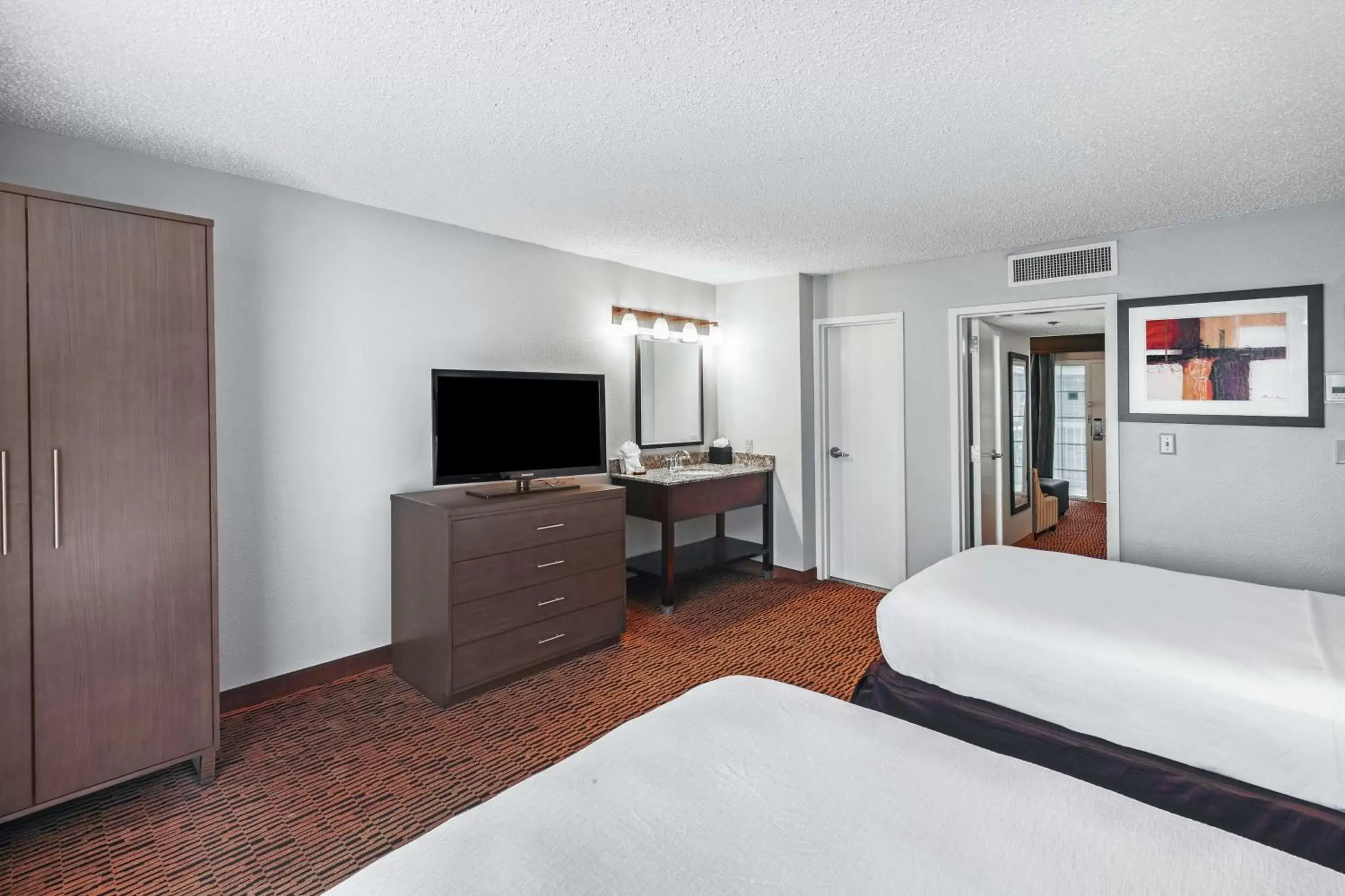 Bed, TV/Entertainment Center in Embassy Suites by Hilton Dallas Market Center