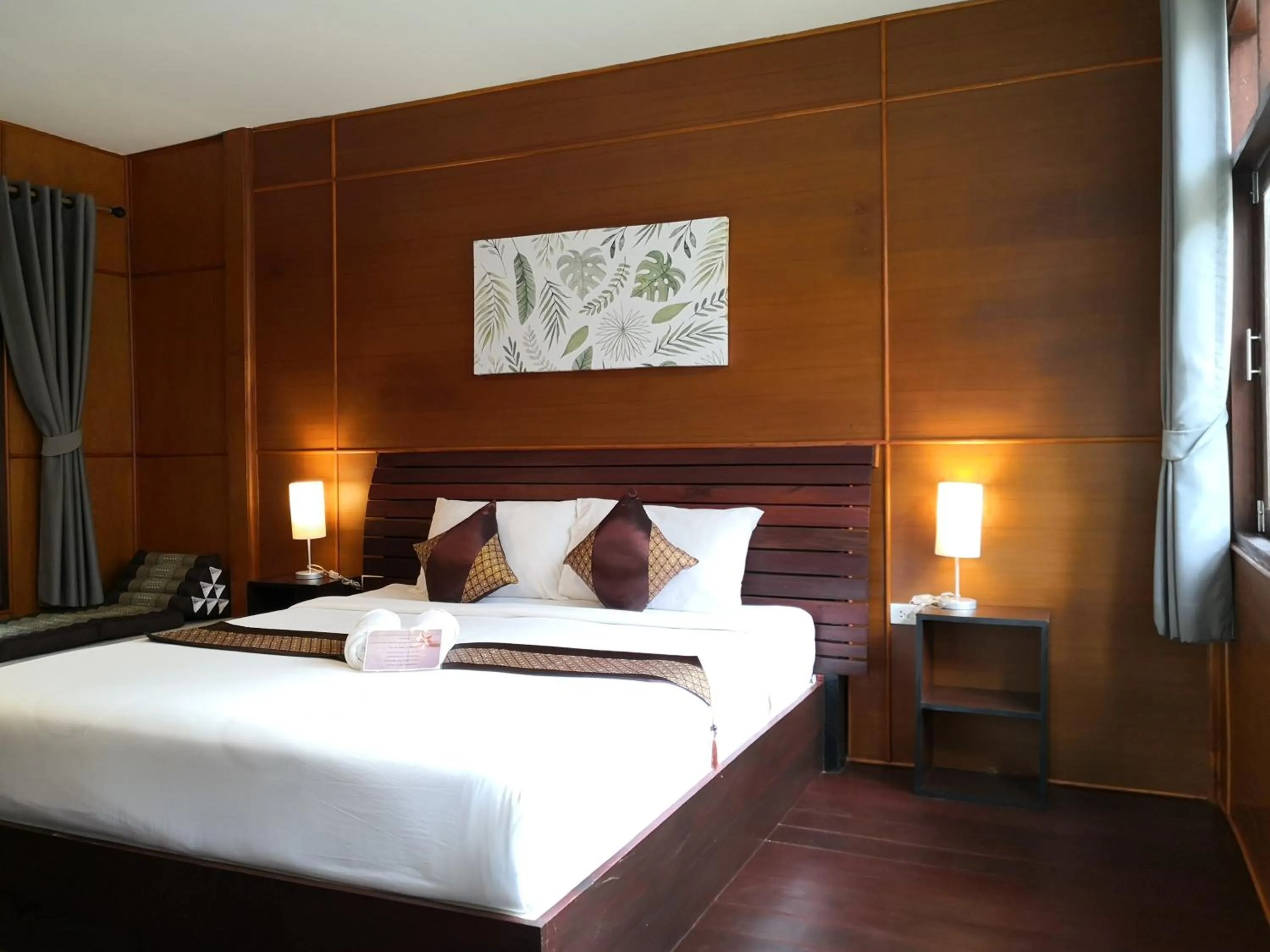 Bed in Baan Suan Rim Klong Resort