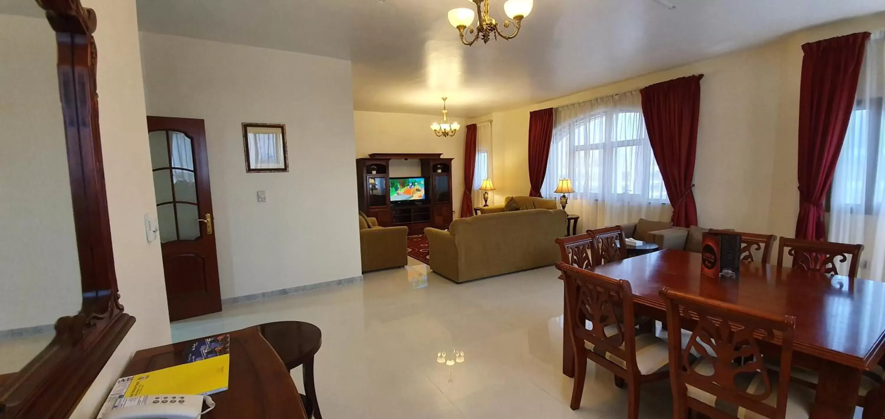 Communal lounge/ TV room, Dining Area in Ivory Hotel Apartments