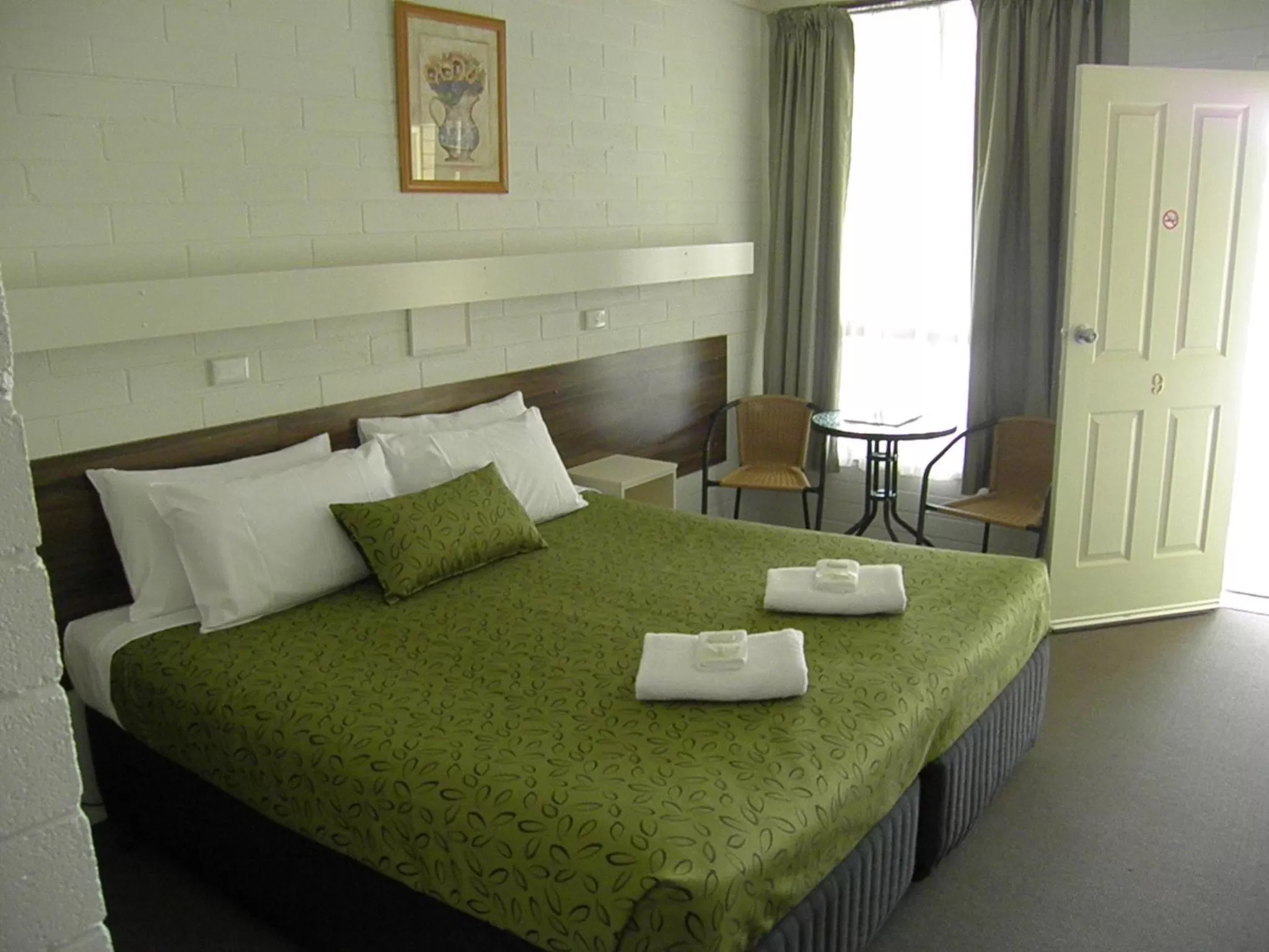 Bed in 7th Street Motel