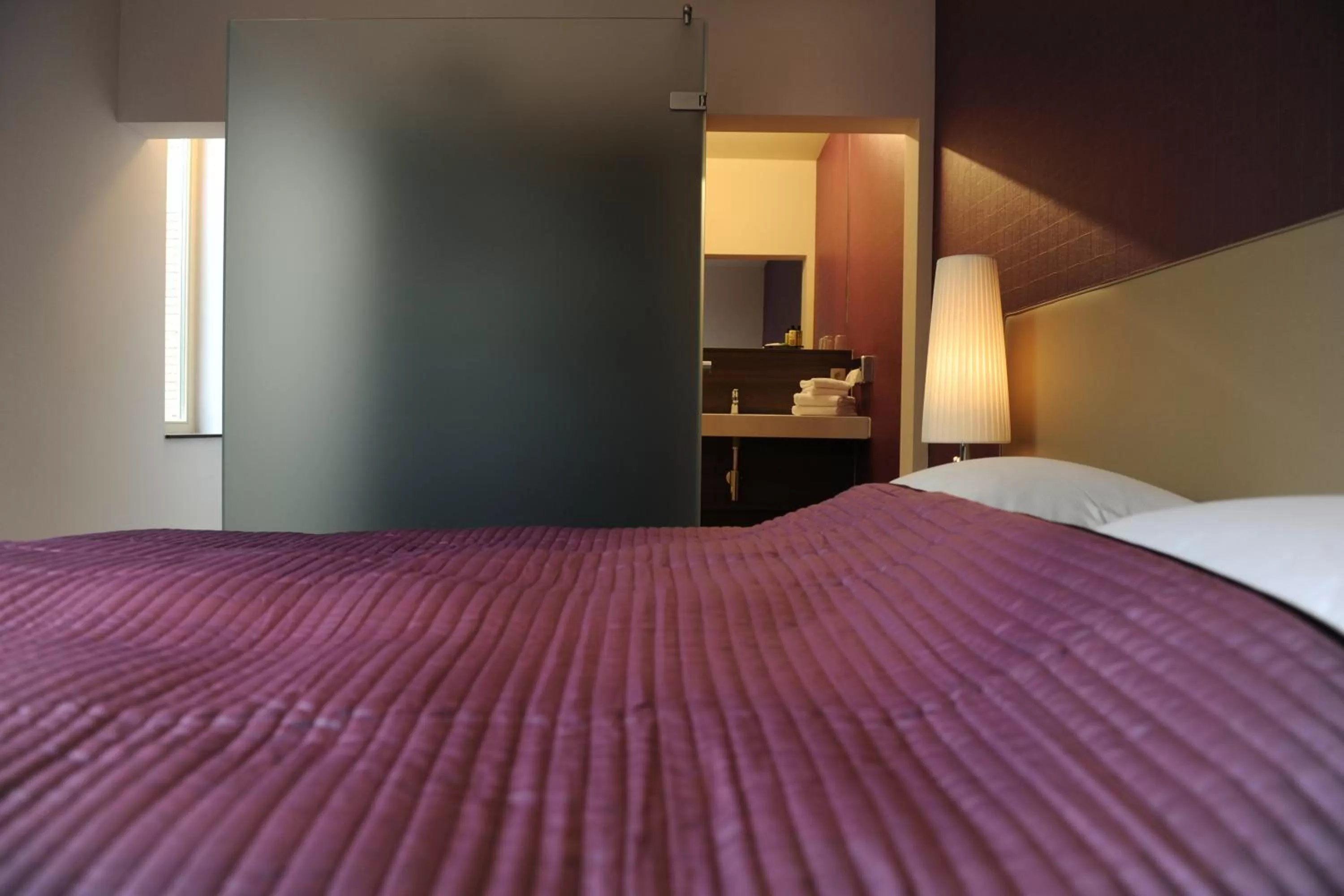 Bed in Charmehotel Villa Saporis