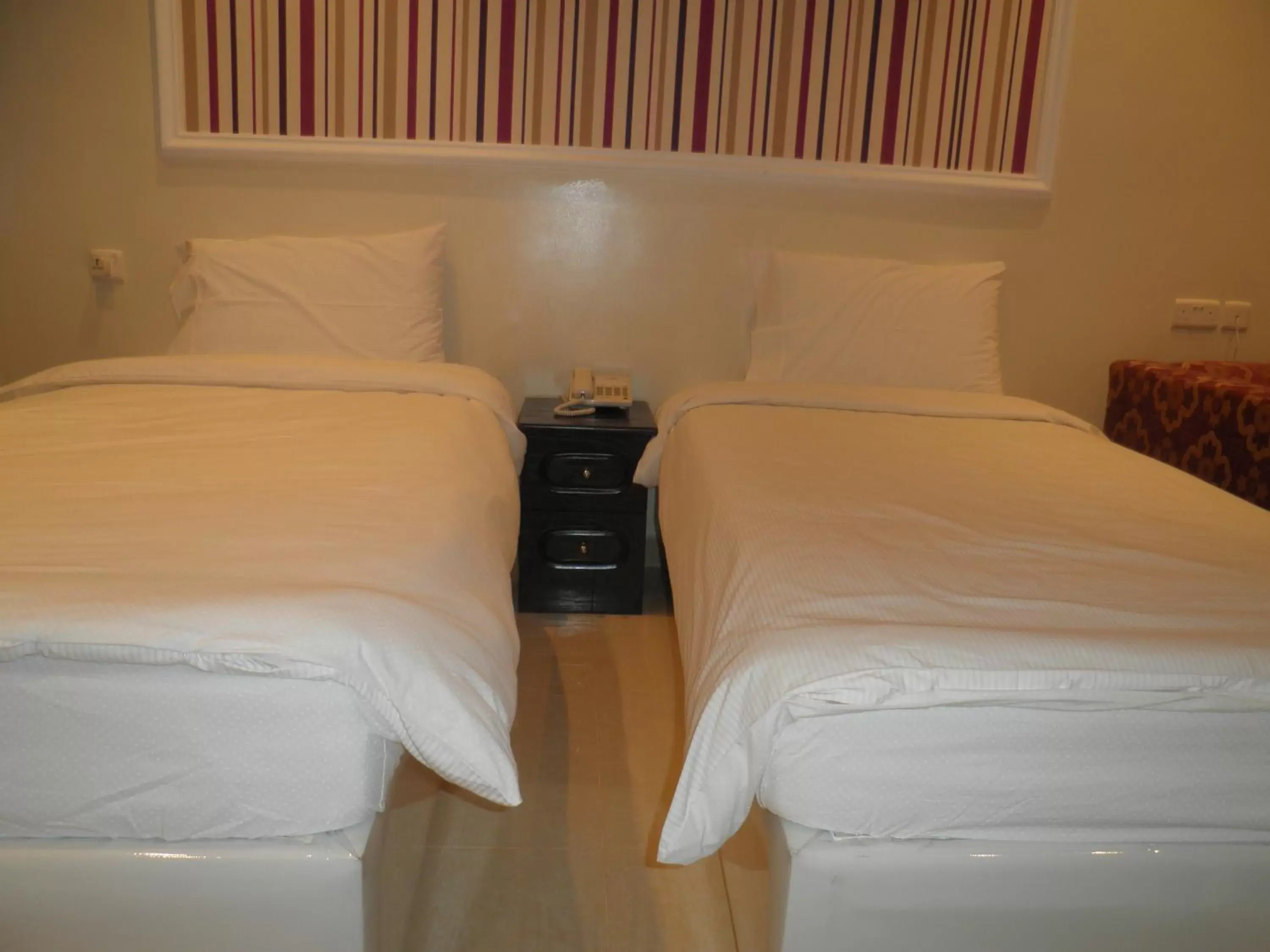 Bed in Marina Royal Hotel Suites