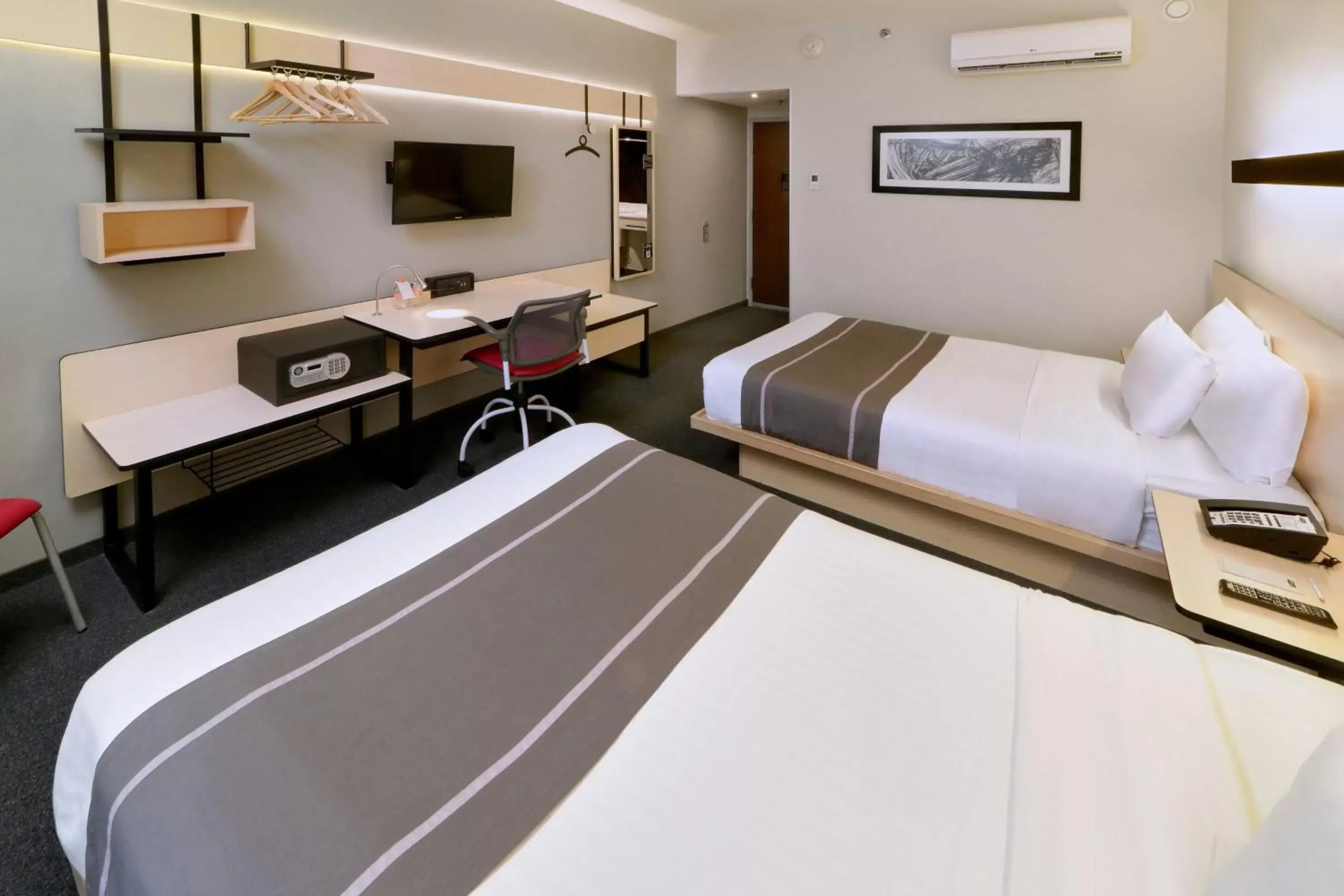 Photo of the whole room, Bed in City Express Plus by Marriott Monterrey Nuevo Sur