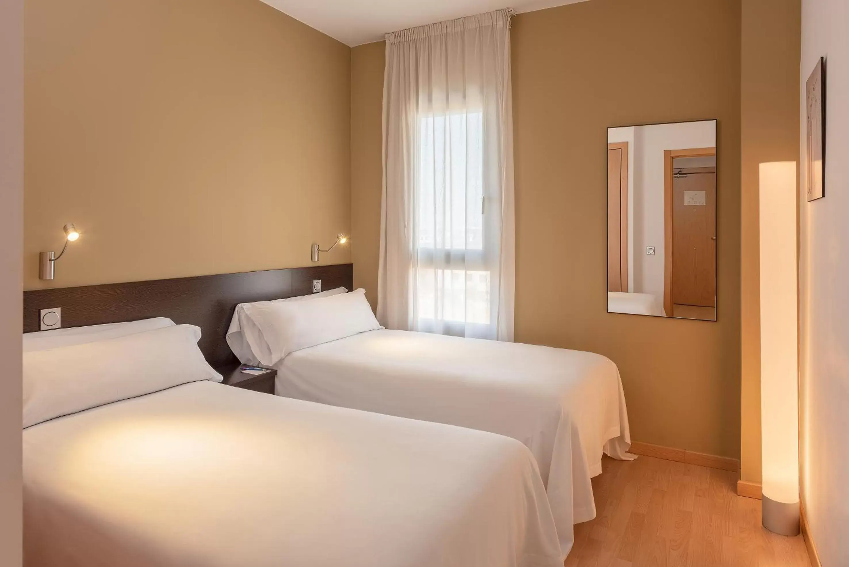 Photo of the whole room, Bed in Madrid Airport Suites, Affiliated by Meliá