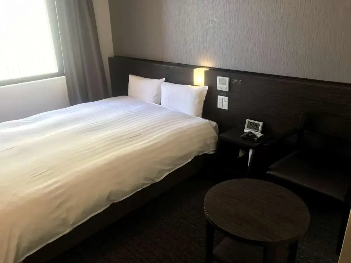 Bed in Dormy Inn Higashi Muroran