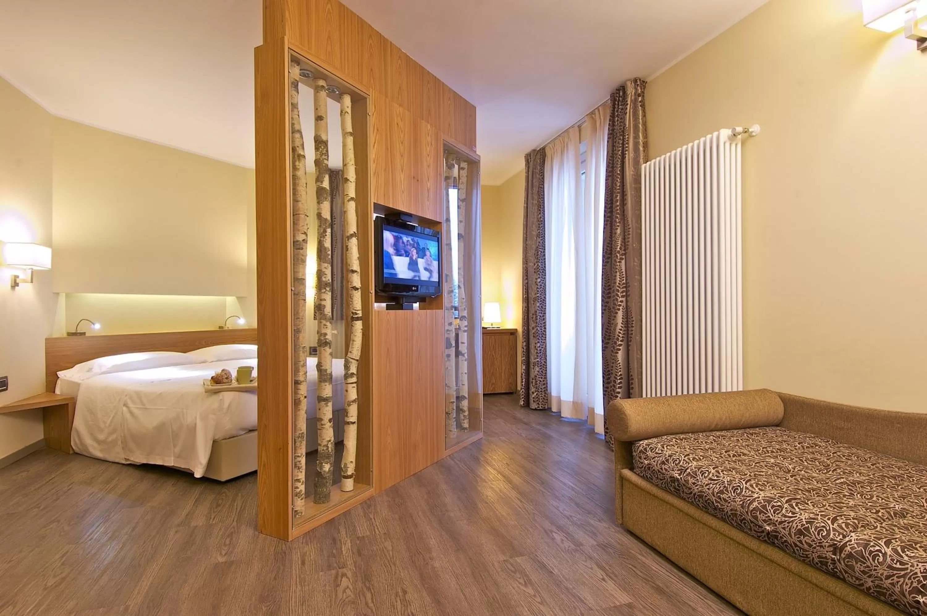 Photo of the whole room, Bed in Harmony Suite Hotel