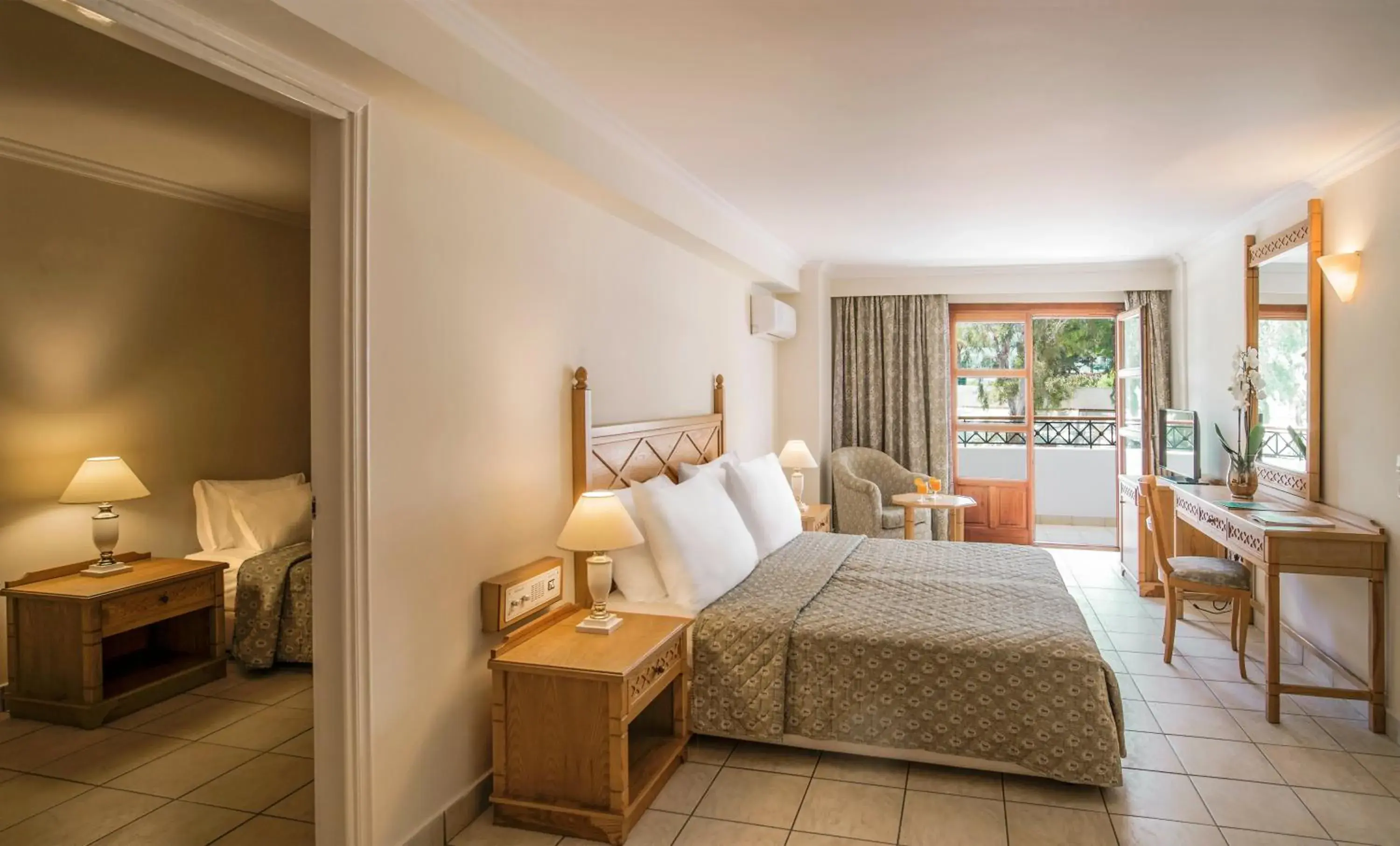 Bedroom in Mitsis Petit Palais Beach Hotel