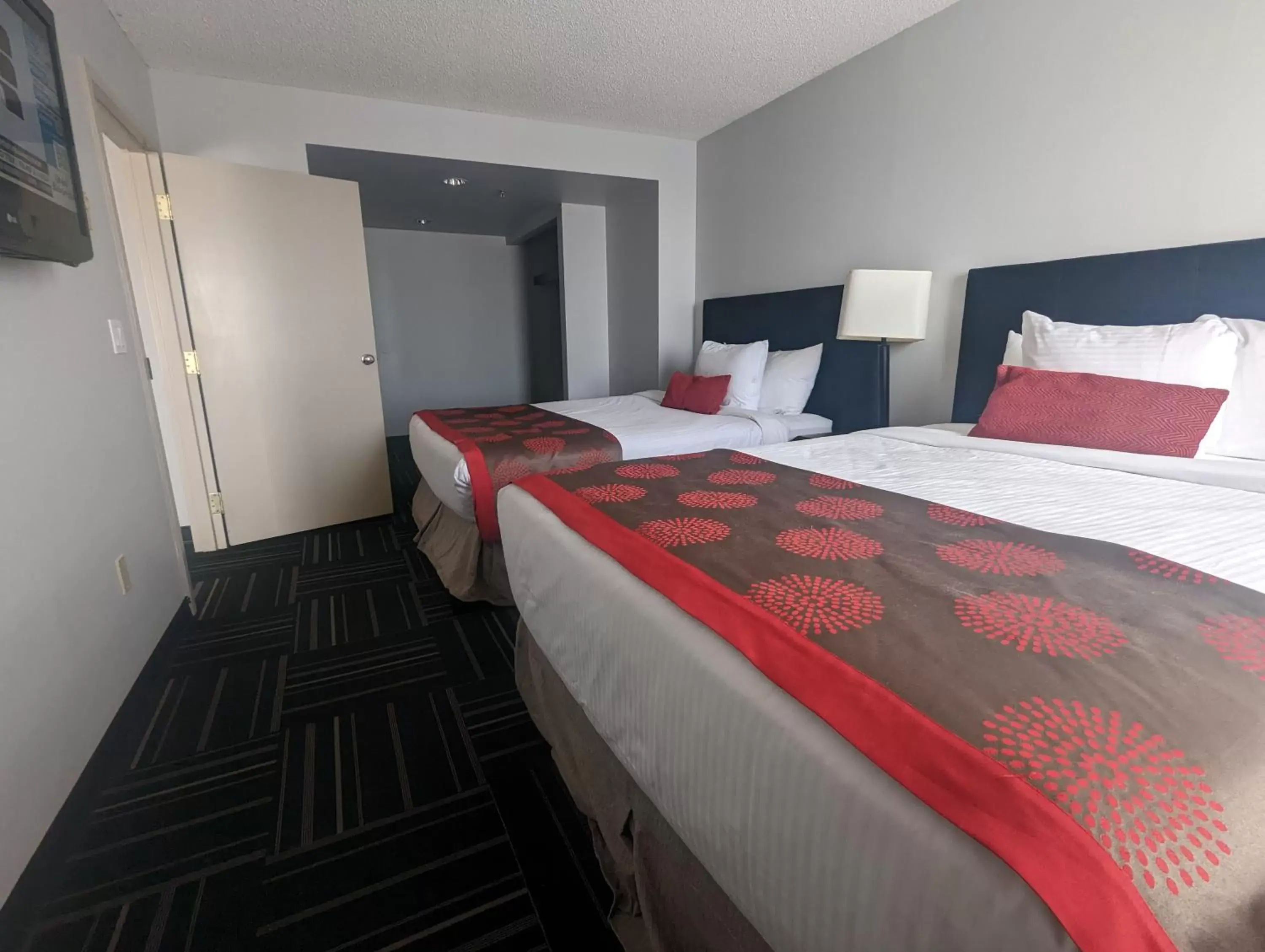 Bed in DIVYA SUTRA Riviera Plaza and Conference Centre Calgary Airport
