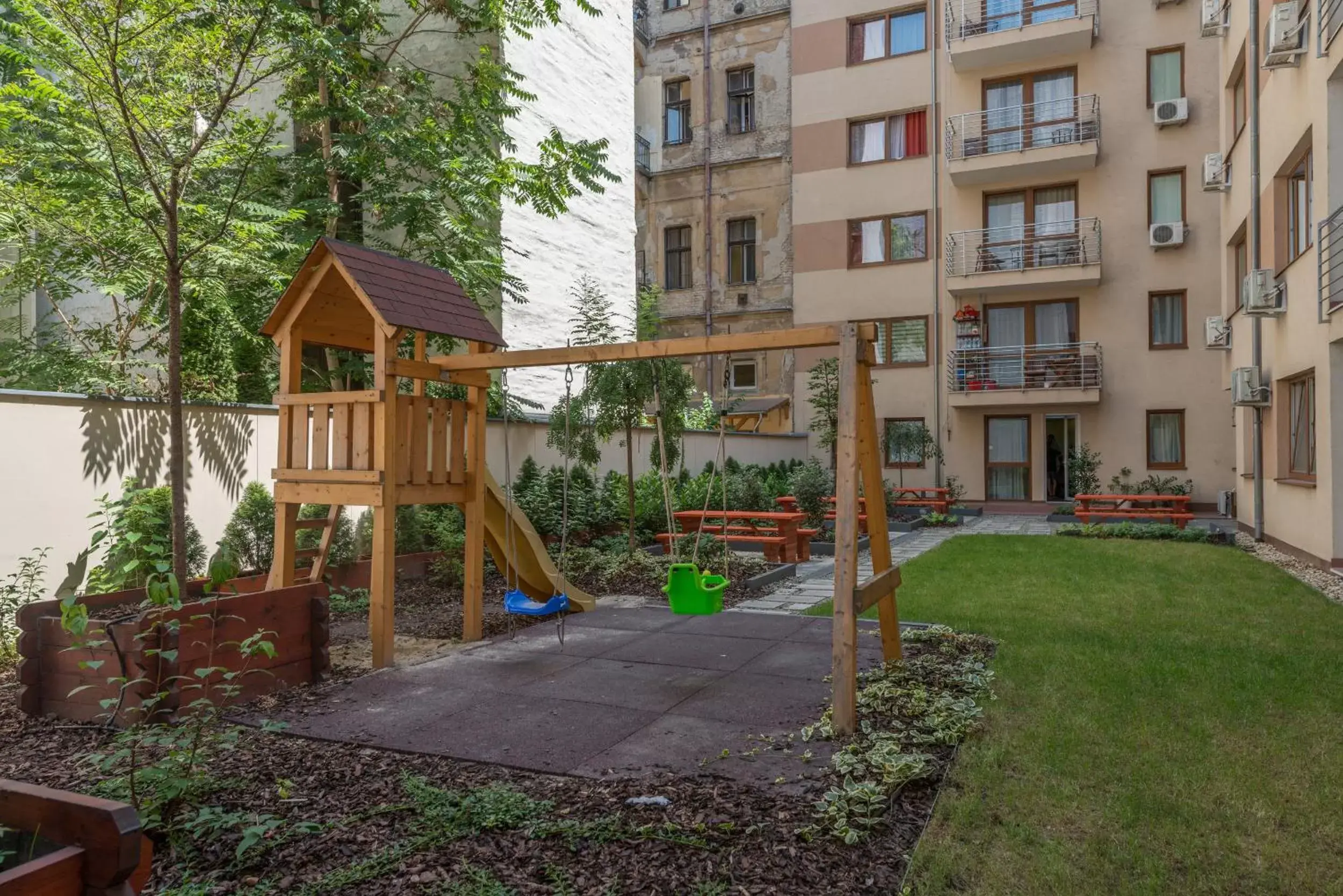 Children play ground in Corvin Plaza Apartments & Suites