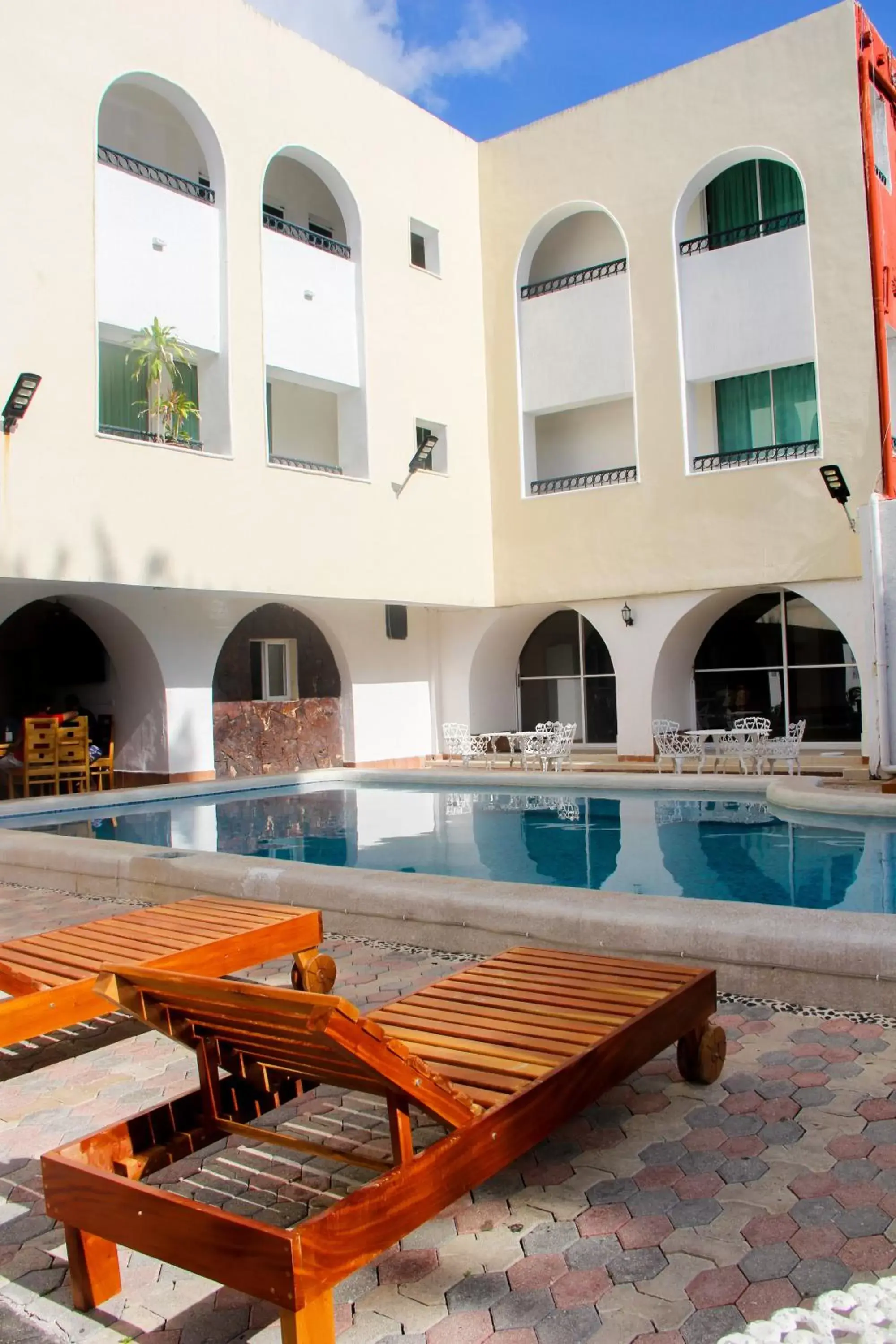 Property building, Swimming Pool in Hotel Maria de Lourdes