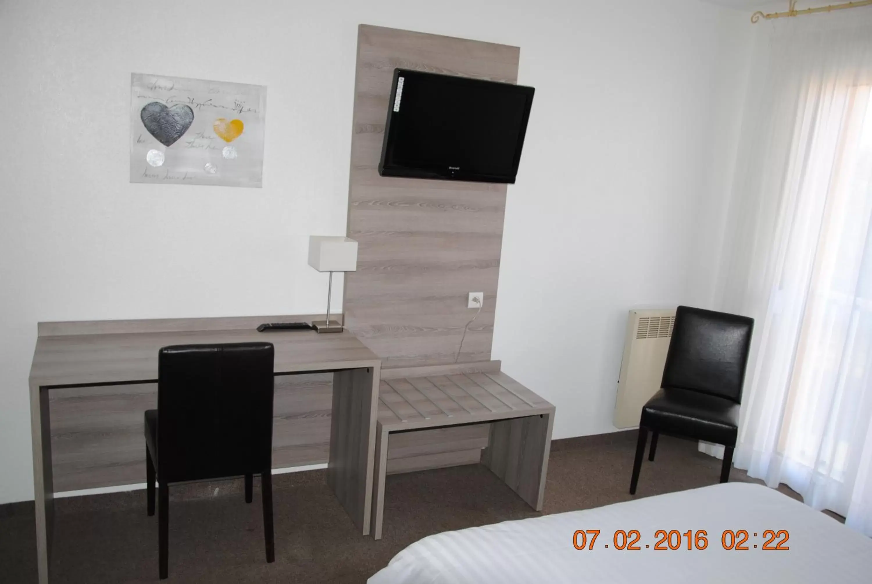 Bedroom, TV/Entertainment Center in Hotel Albizzia