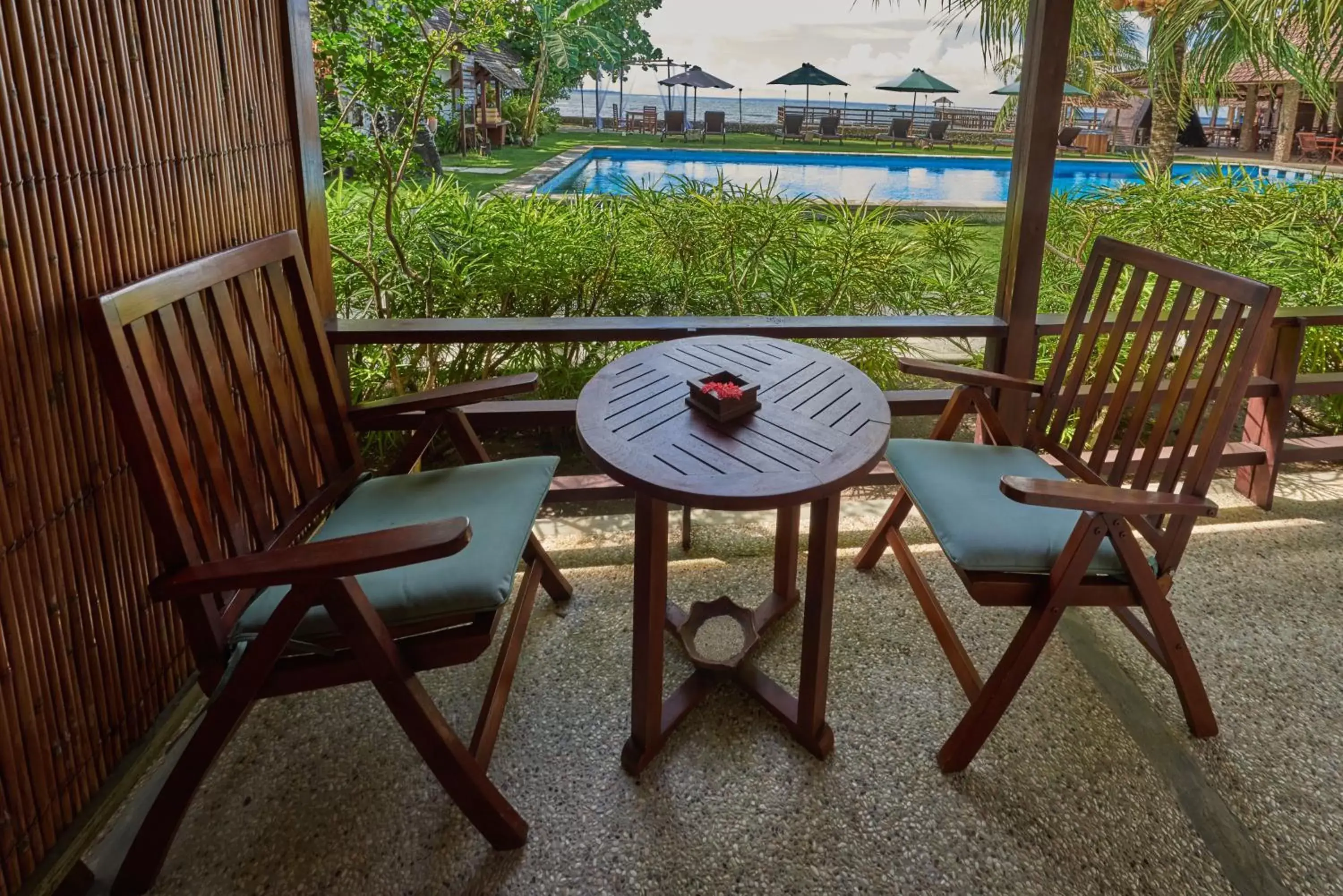 Balcony/Terrace, Pool View in Cocotinos Manado