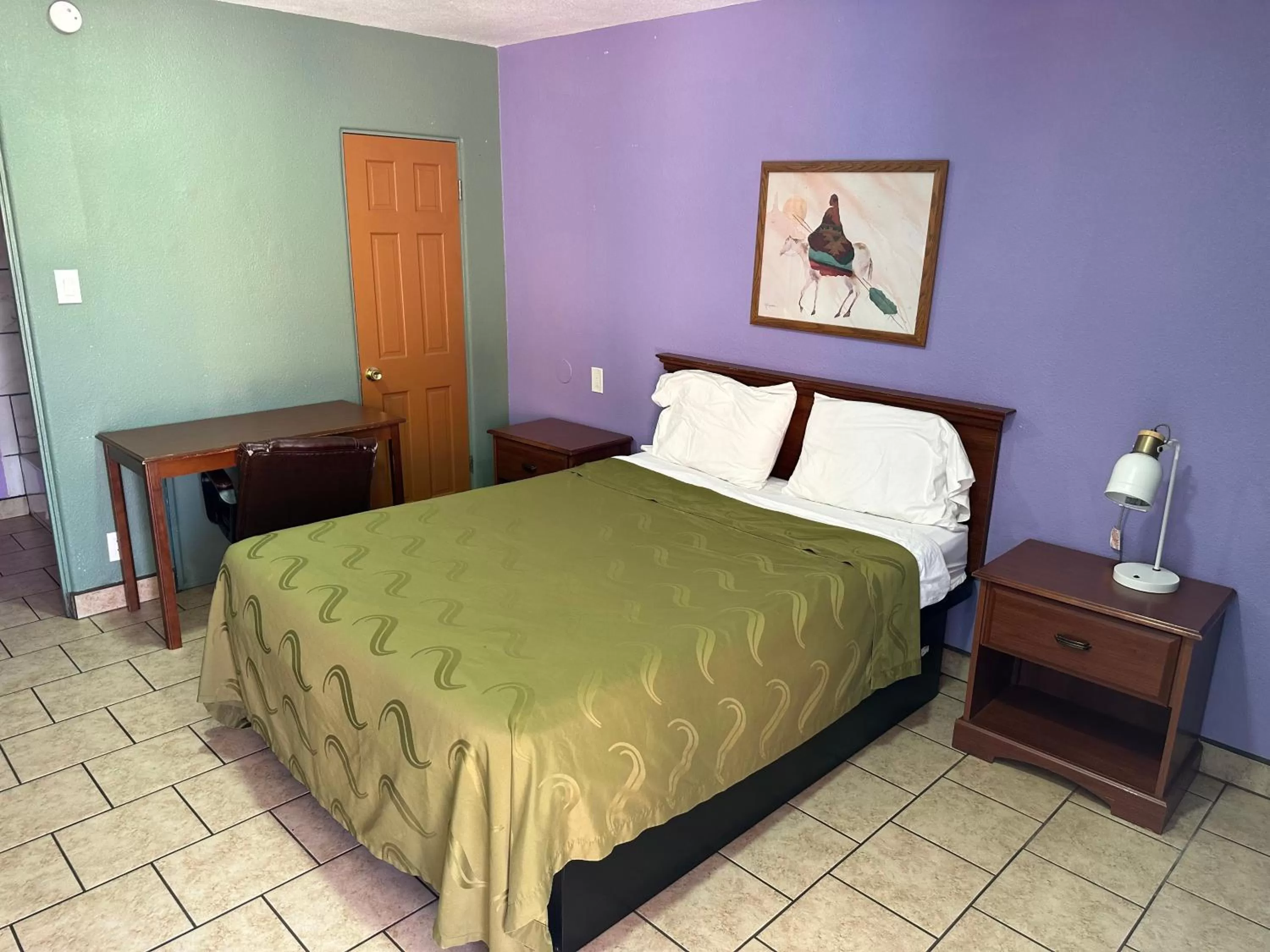 Bed in Western Inn Roswell