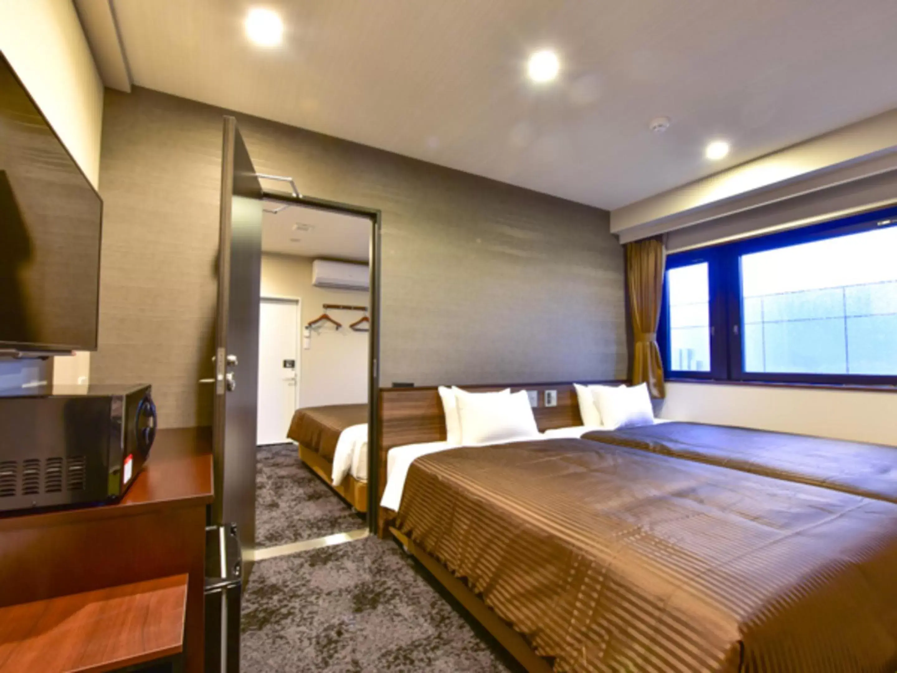 Bed in HOTEL LiVEMAX Fukuoka Tenjin West