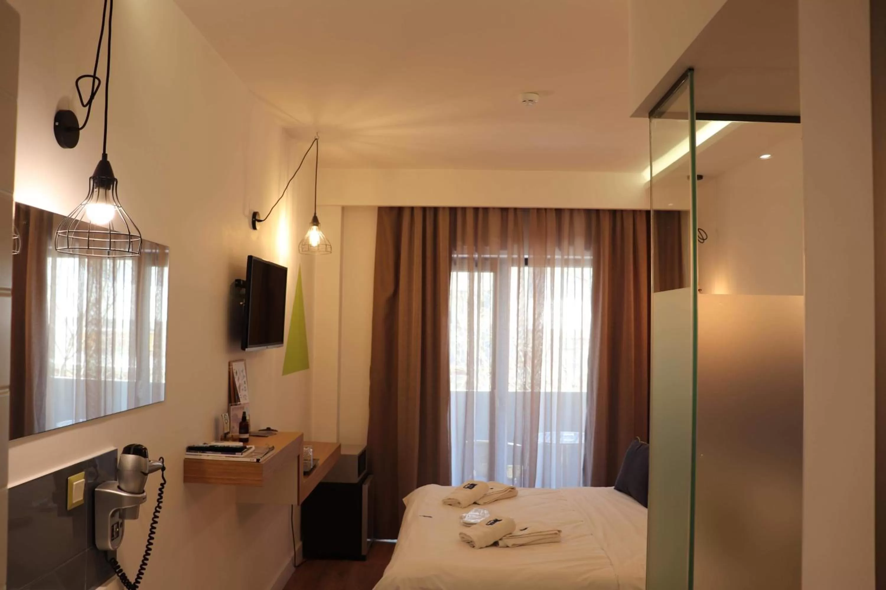 Bed in Blue Bottle Boutique Hotel