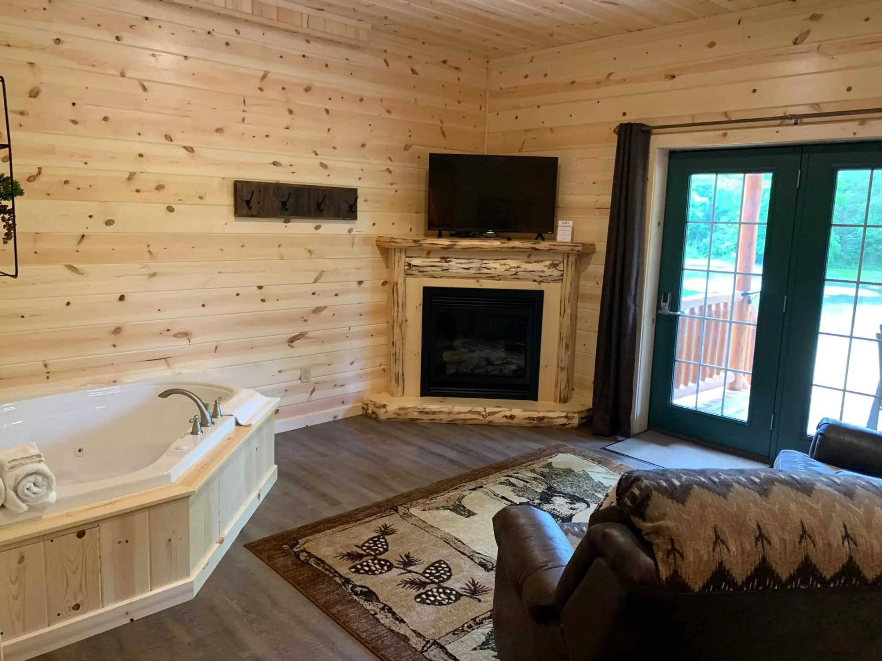 Living room, TV/Entertainment Center in Waterview Lodge by Amish Country Lodging