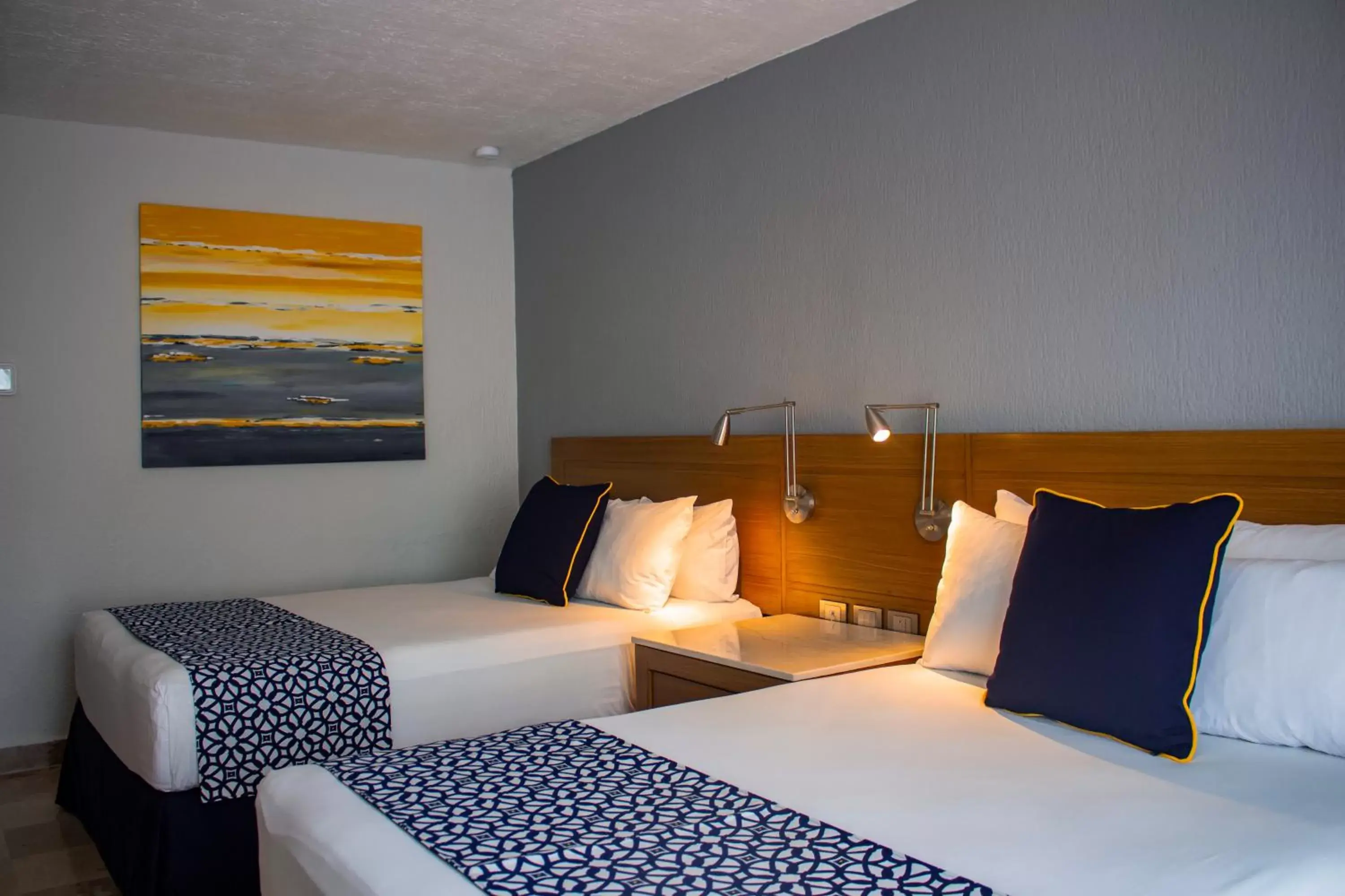 Bed in Plaza Pelicanos Club Beach Resort All Inclusive