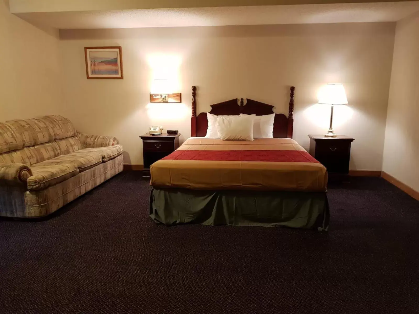 Bed in Denison Inn & Suites