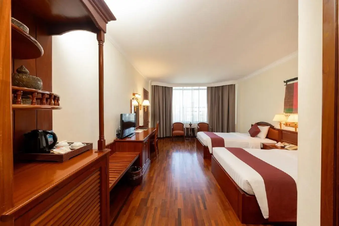 Bed in Khemara Angkor Hotel & Spa