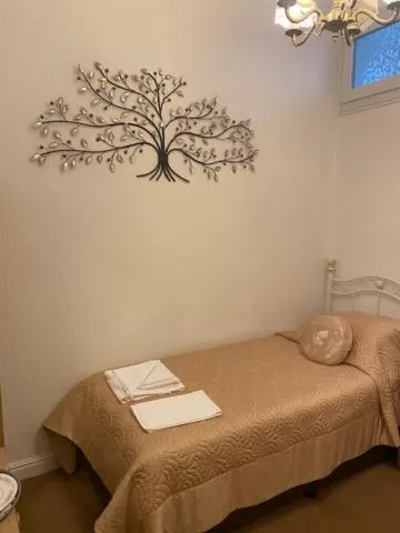 Bed in Parlors Hall Hotel