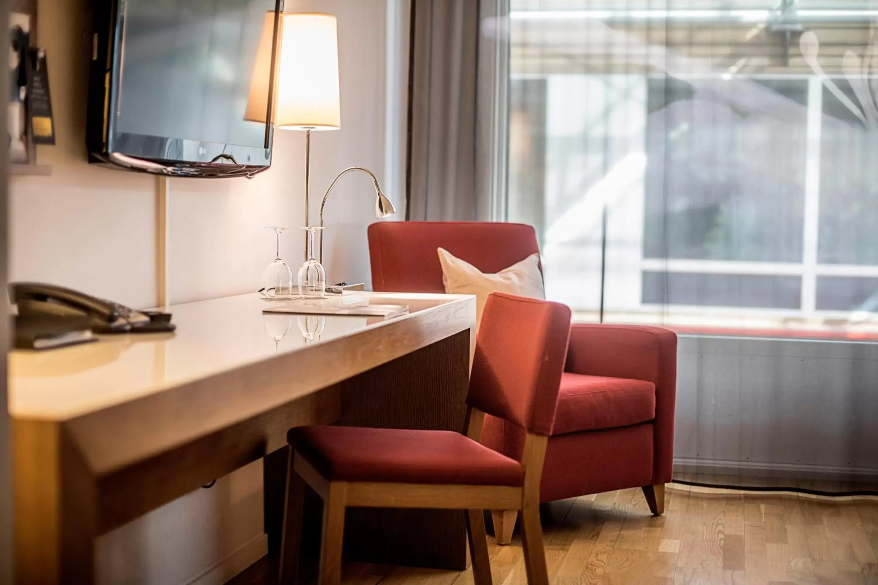 Seating area, TV/Entertainment Center in First Hotel G