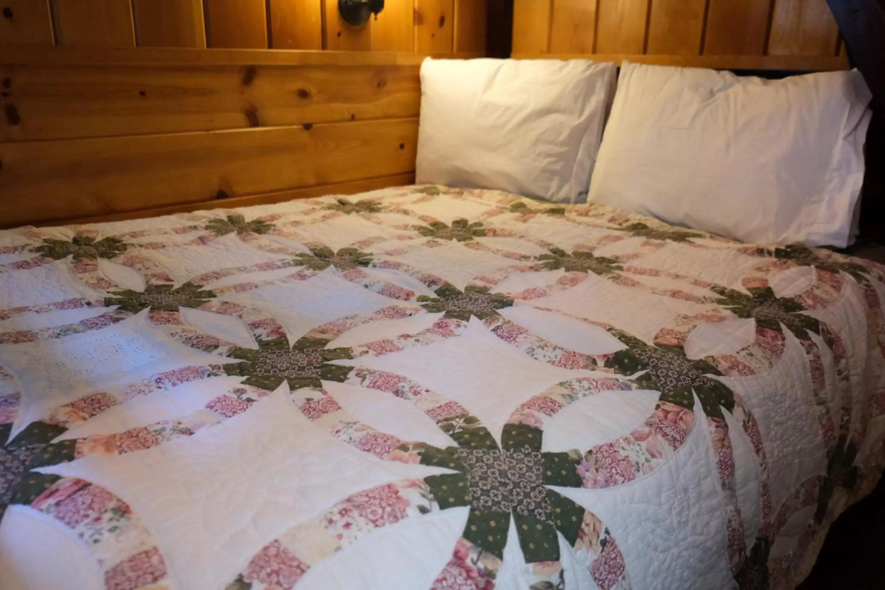 Bed in Lake Front Cabins