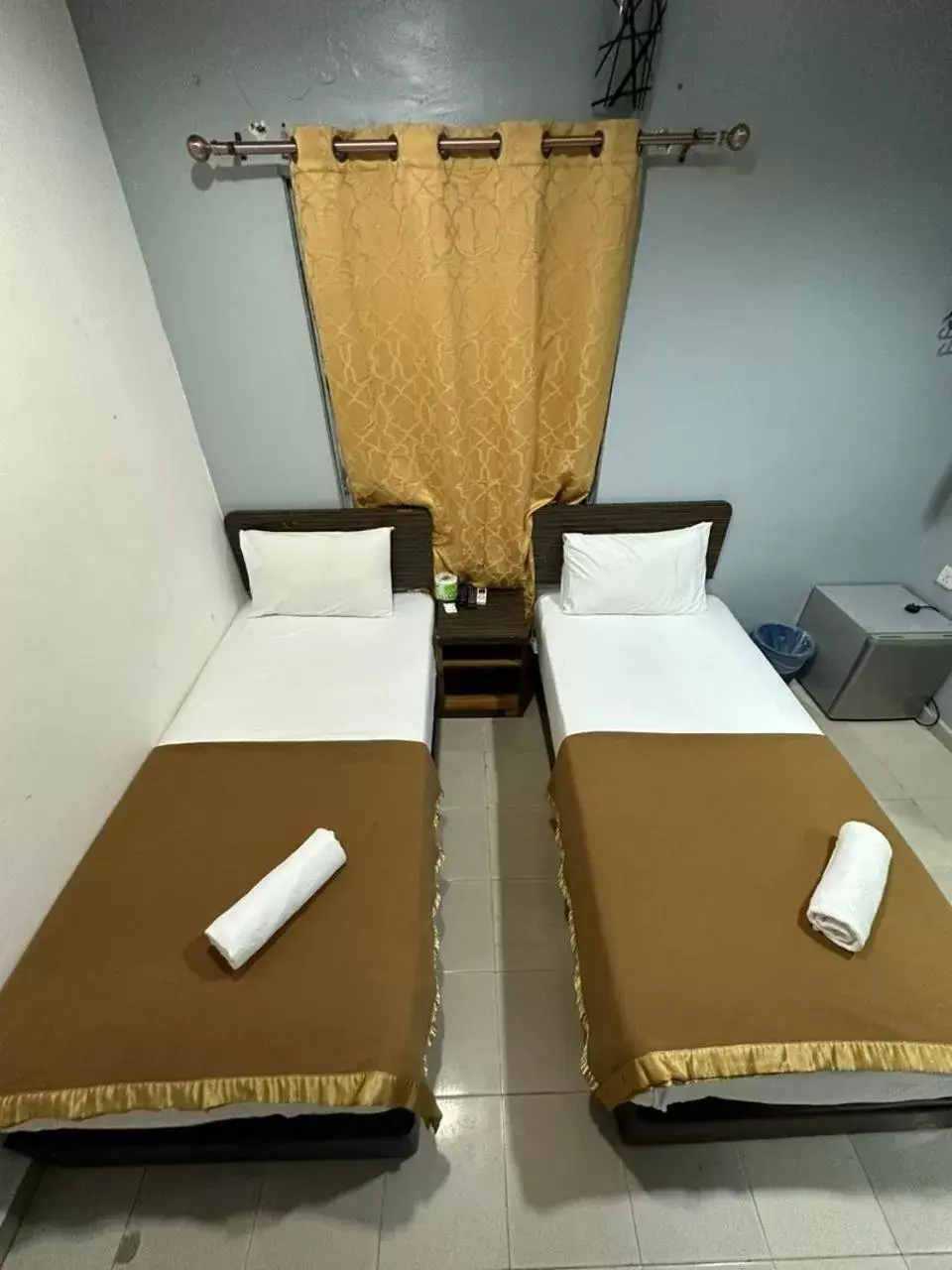 Bed in ISLAND TIME MOTEL KUAH