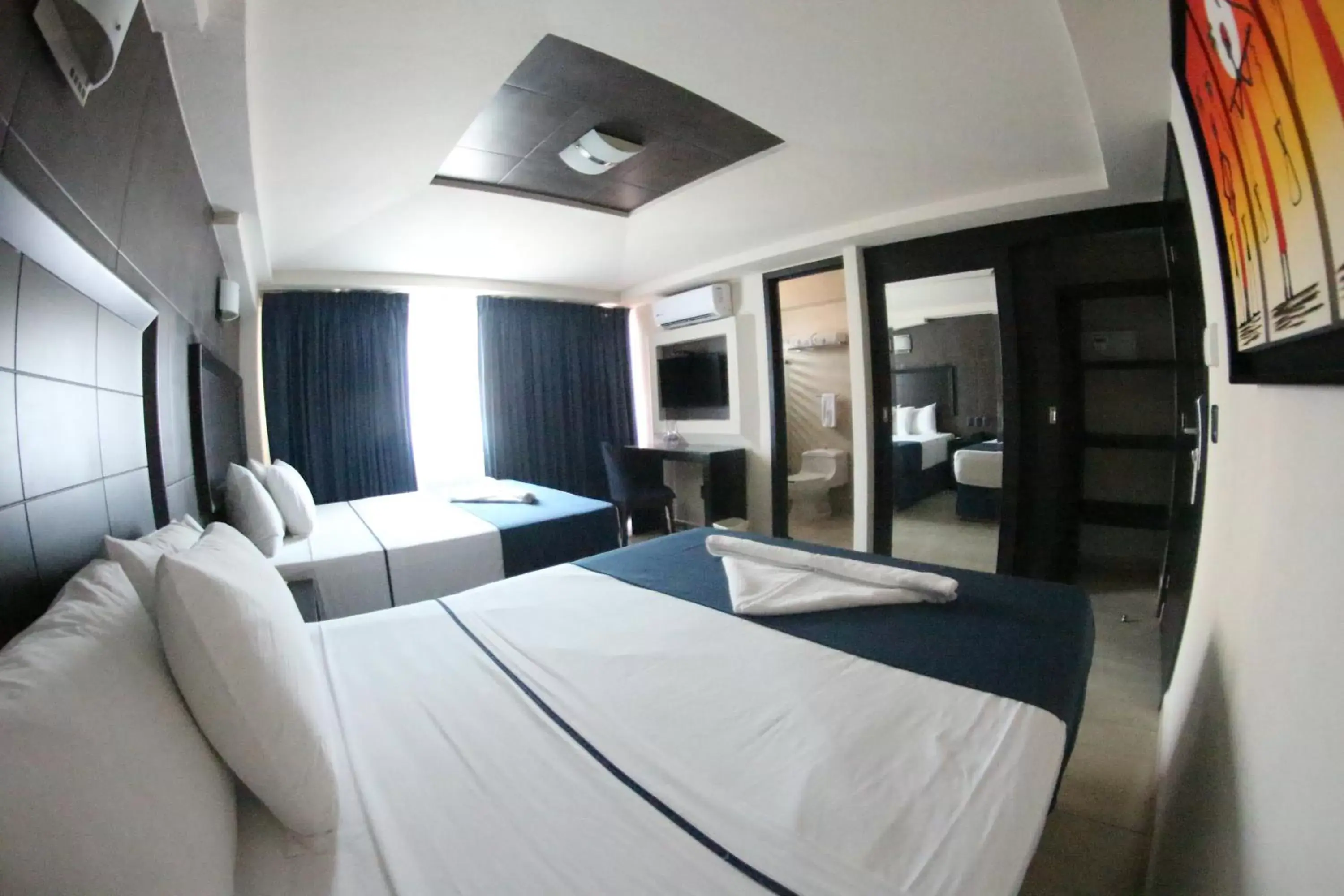 Photo of the whole room, Bed in Hotel Portonovo Plaza Malecon