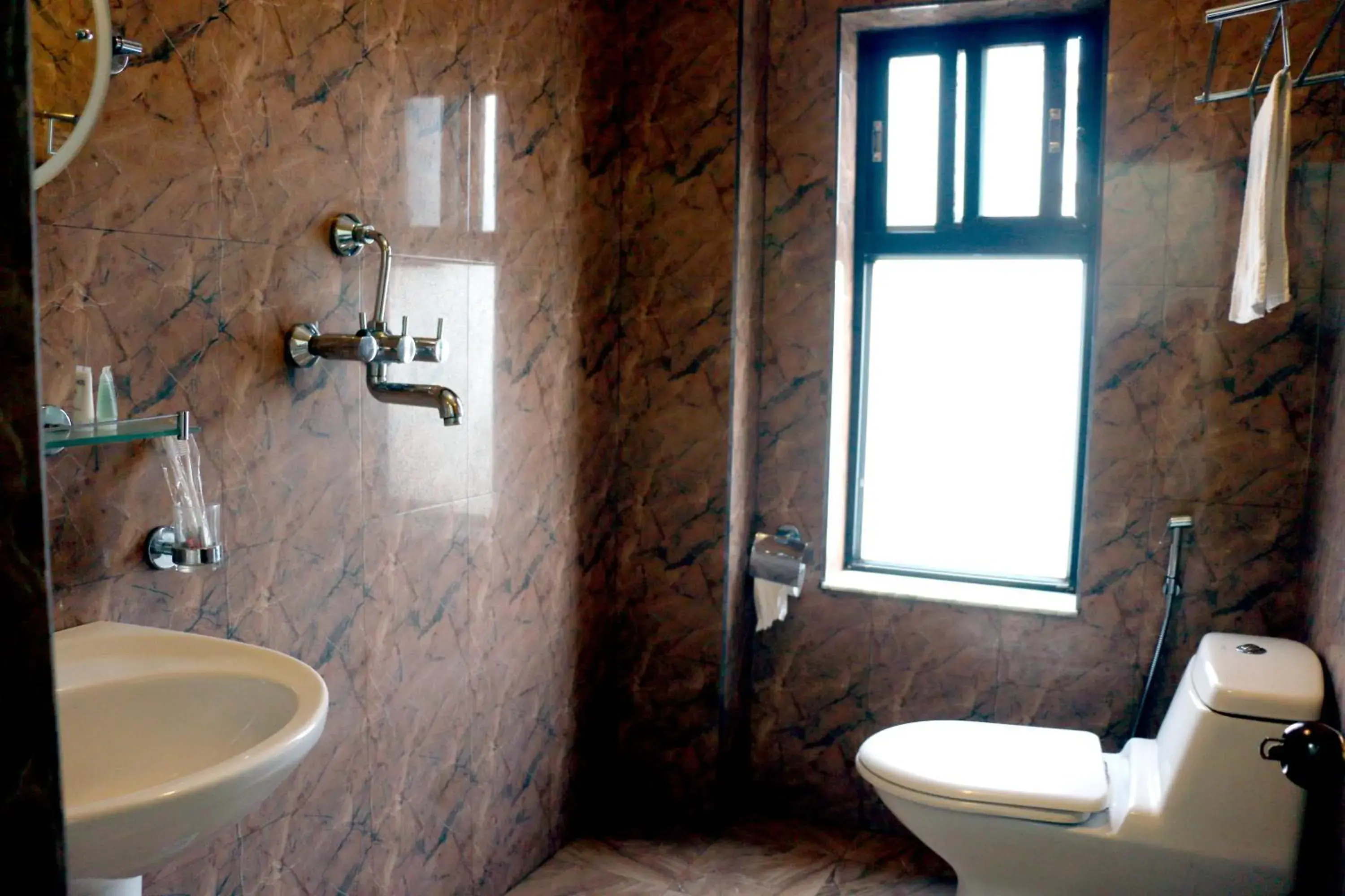 Bathroom in Alpine Hotel & Apartment