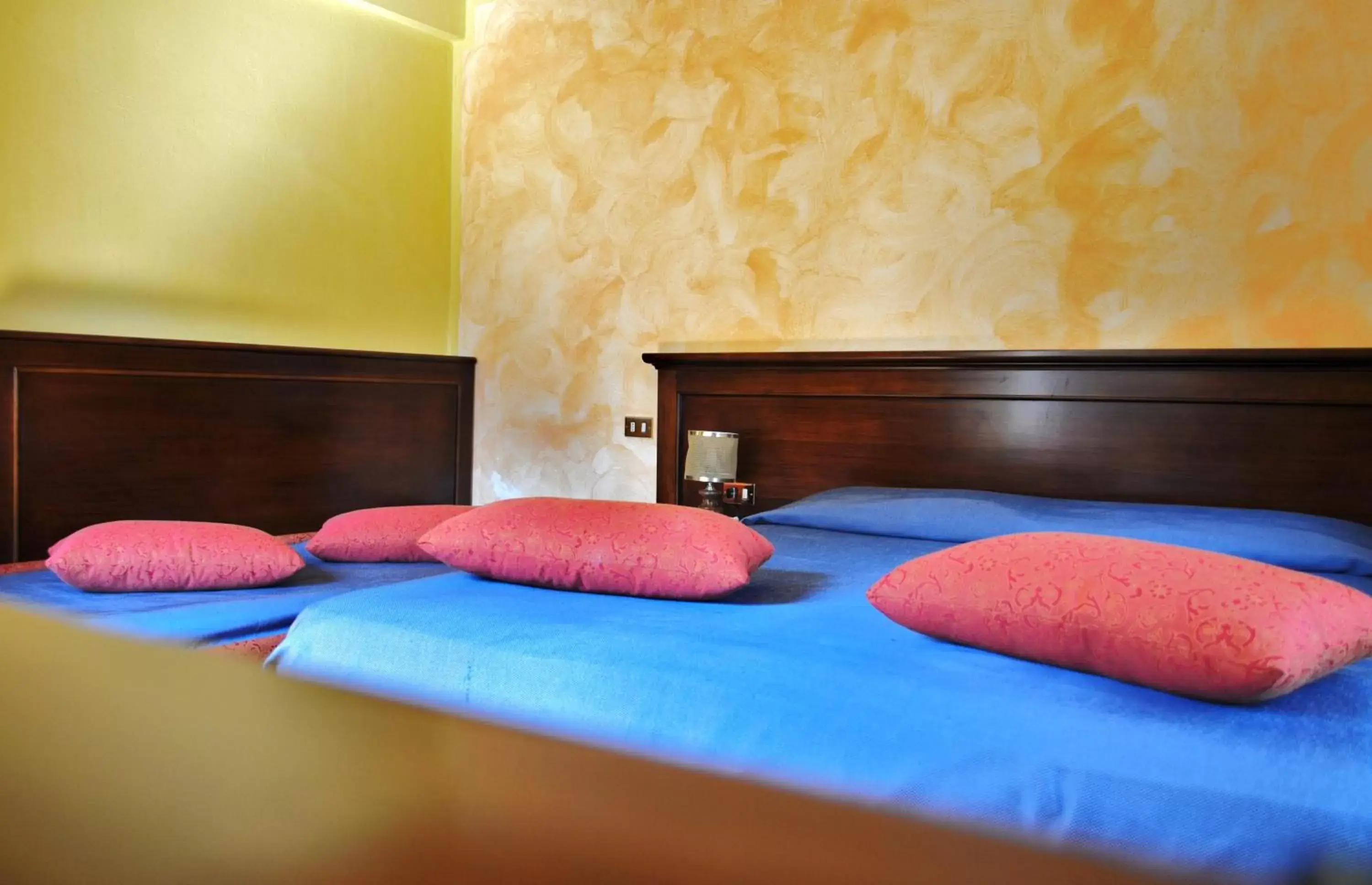 Bed in Albergo Miramonti