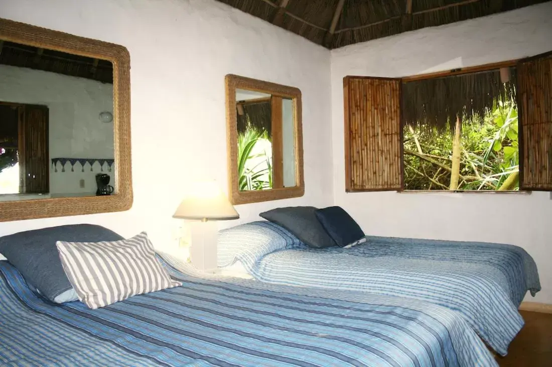 Bed in Junto al Rio Bungalows & Suites