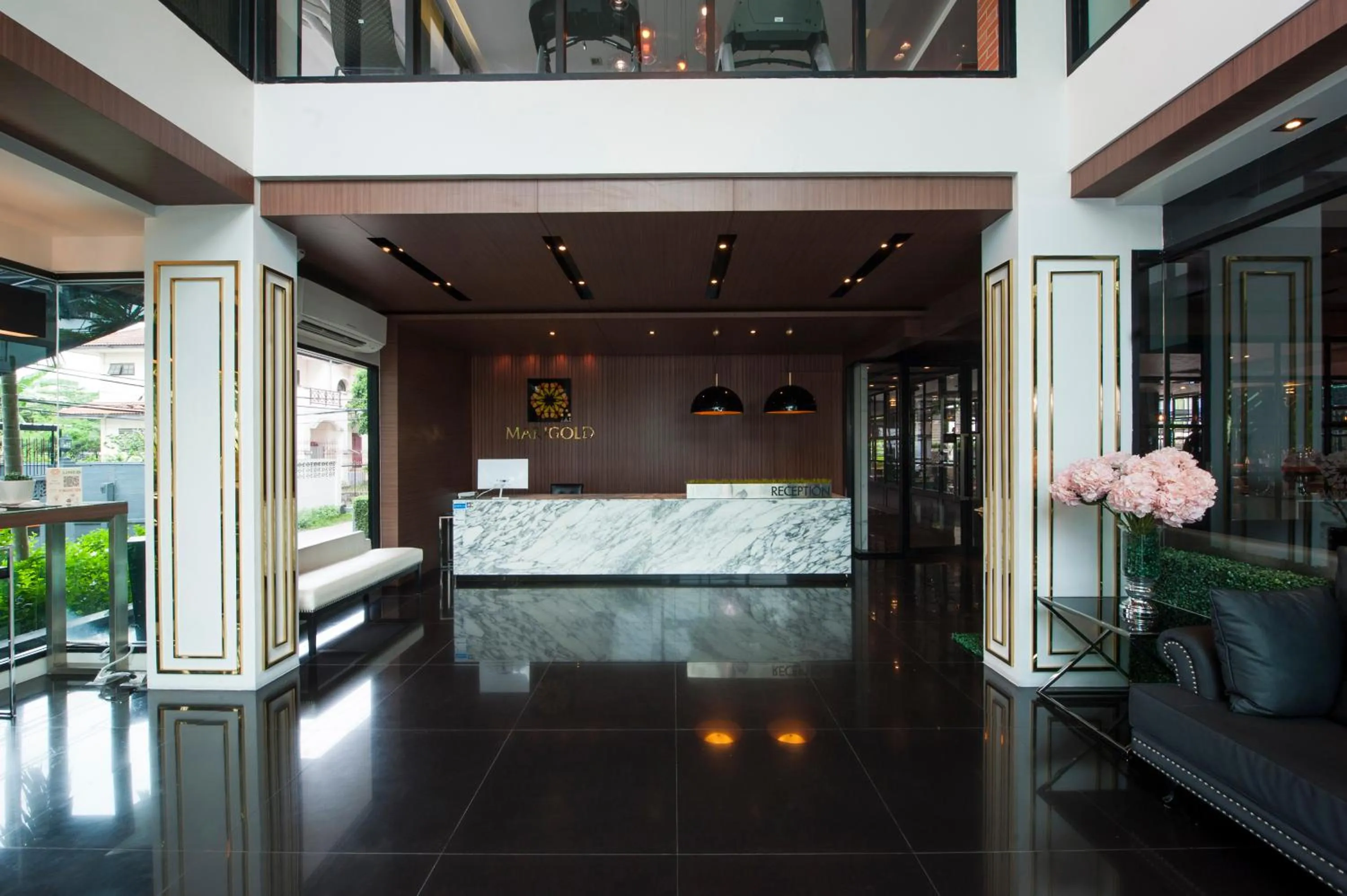 Lobby or reception in Marigold Sukhumvit - Free Shuttle to BTS Bearing Station
