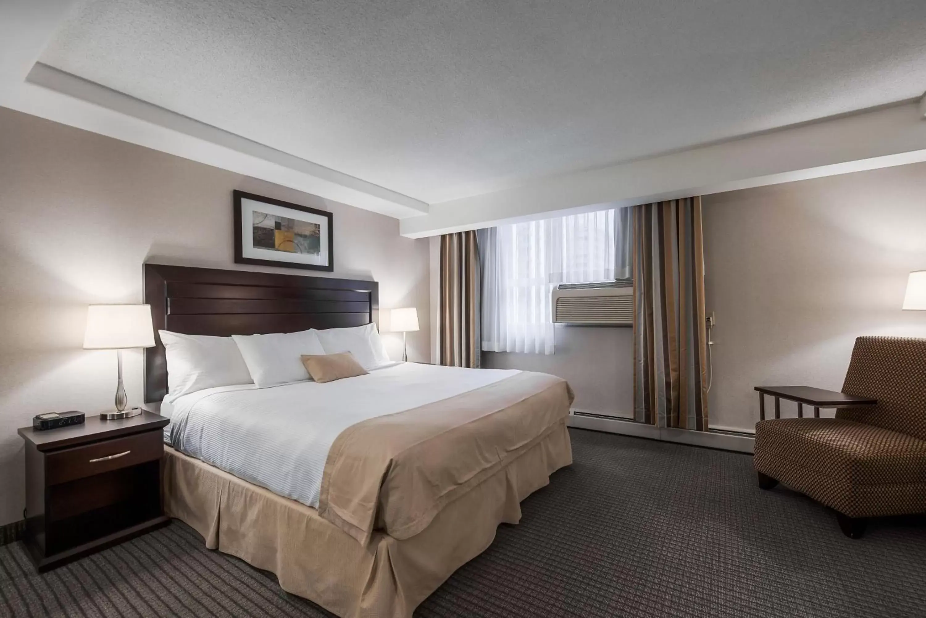 Bed in Coast Calgary Downtown Hotel & Suites by APA