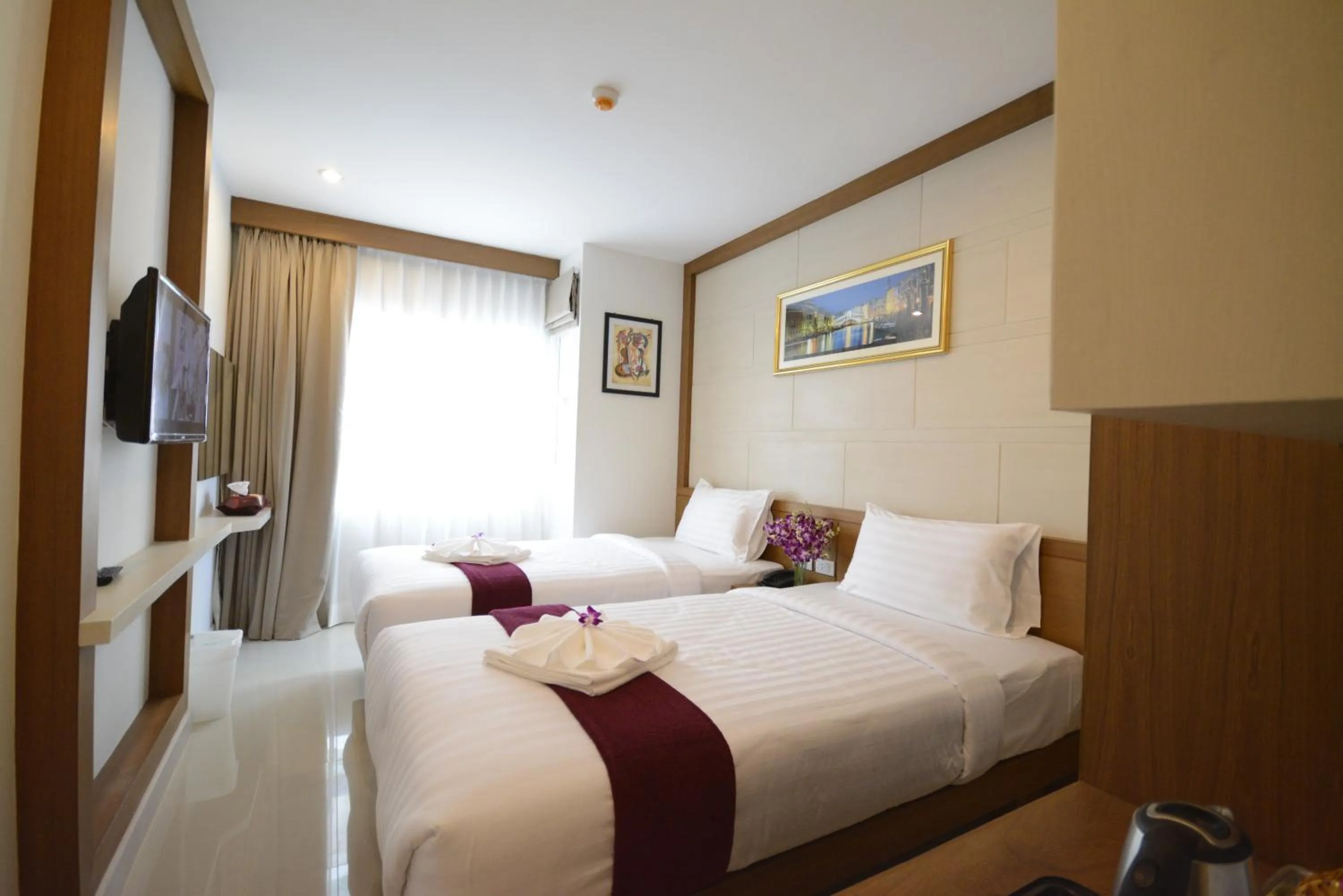 Bed in The Patong Center Hotel