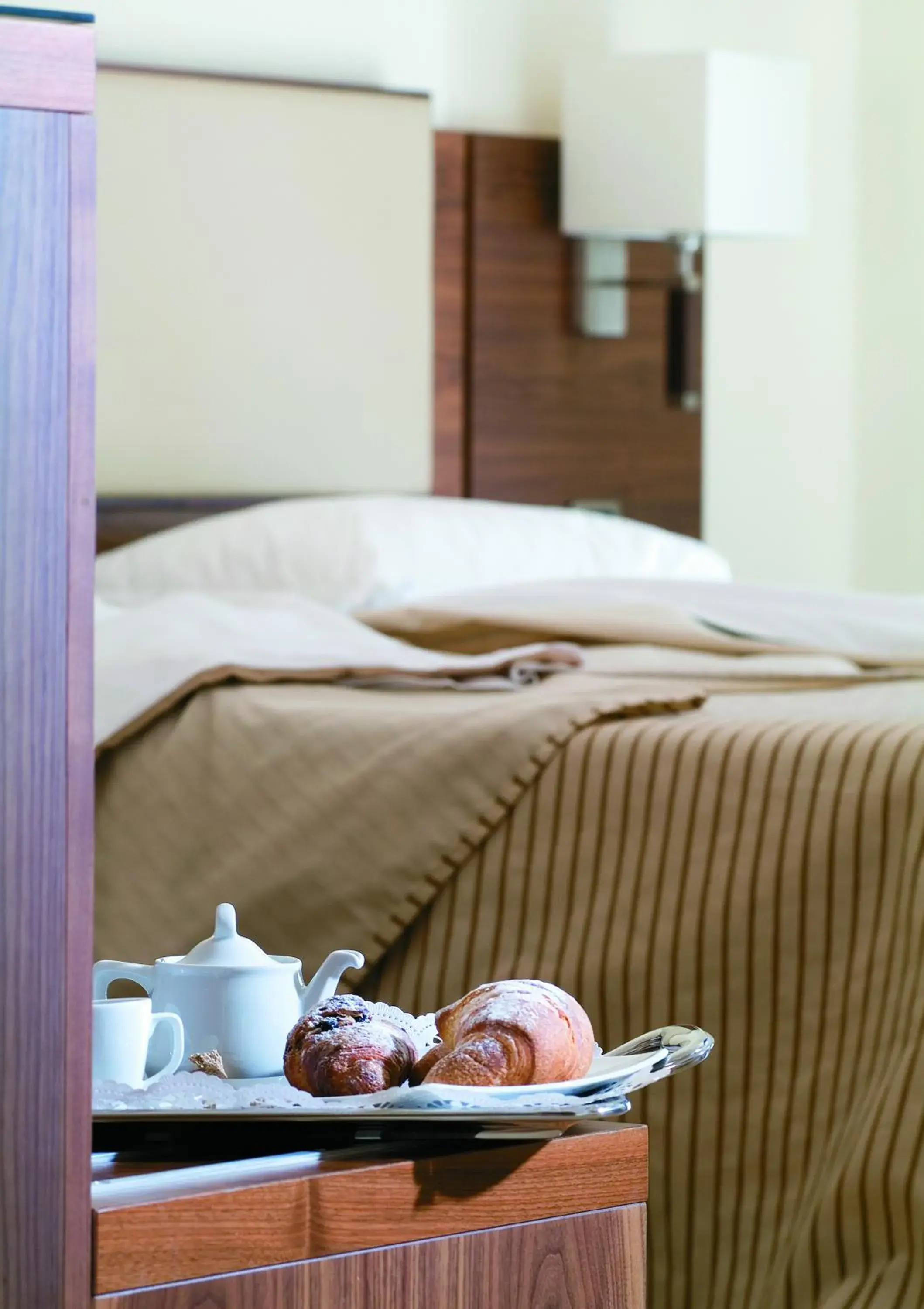 Bed in Suites & Residence Hotel