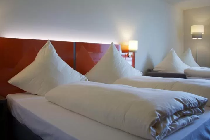 Bed in iQ-Hotel Ulm