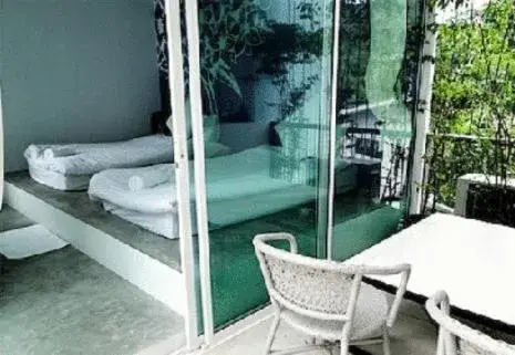 Balcony/Terrace, Bed in White@Sea Resort Balcony/Terrace, Bed in White@Sea Resort