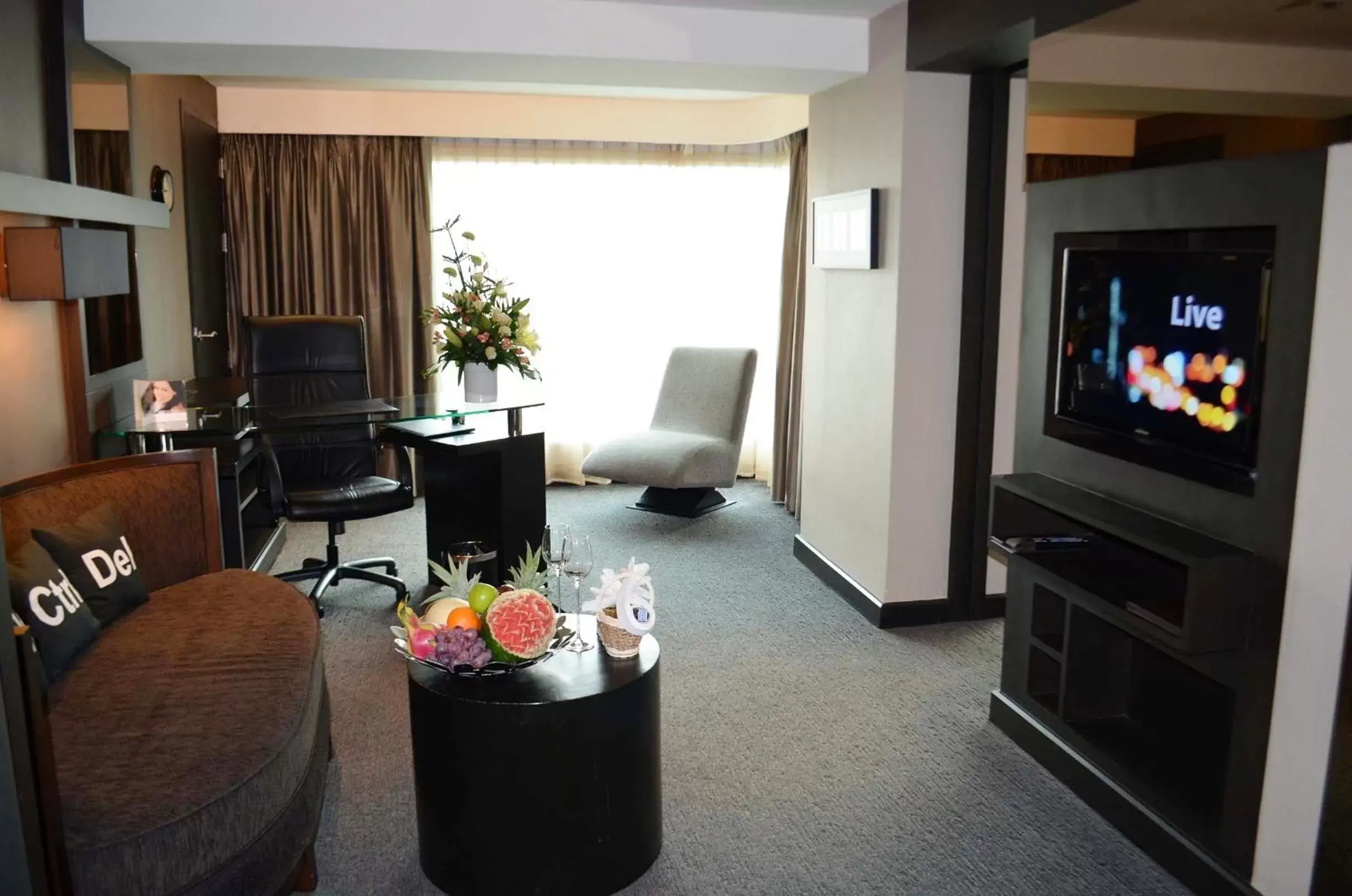 Living room, TV/Entertainment Center in Golden Tulip Mandison Suites