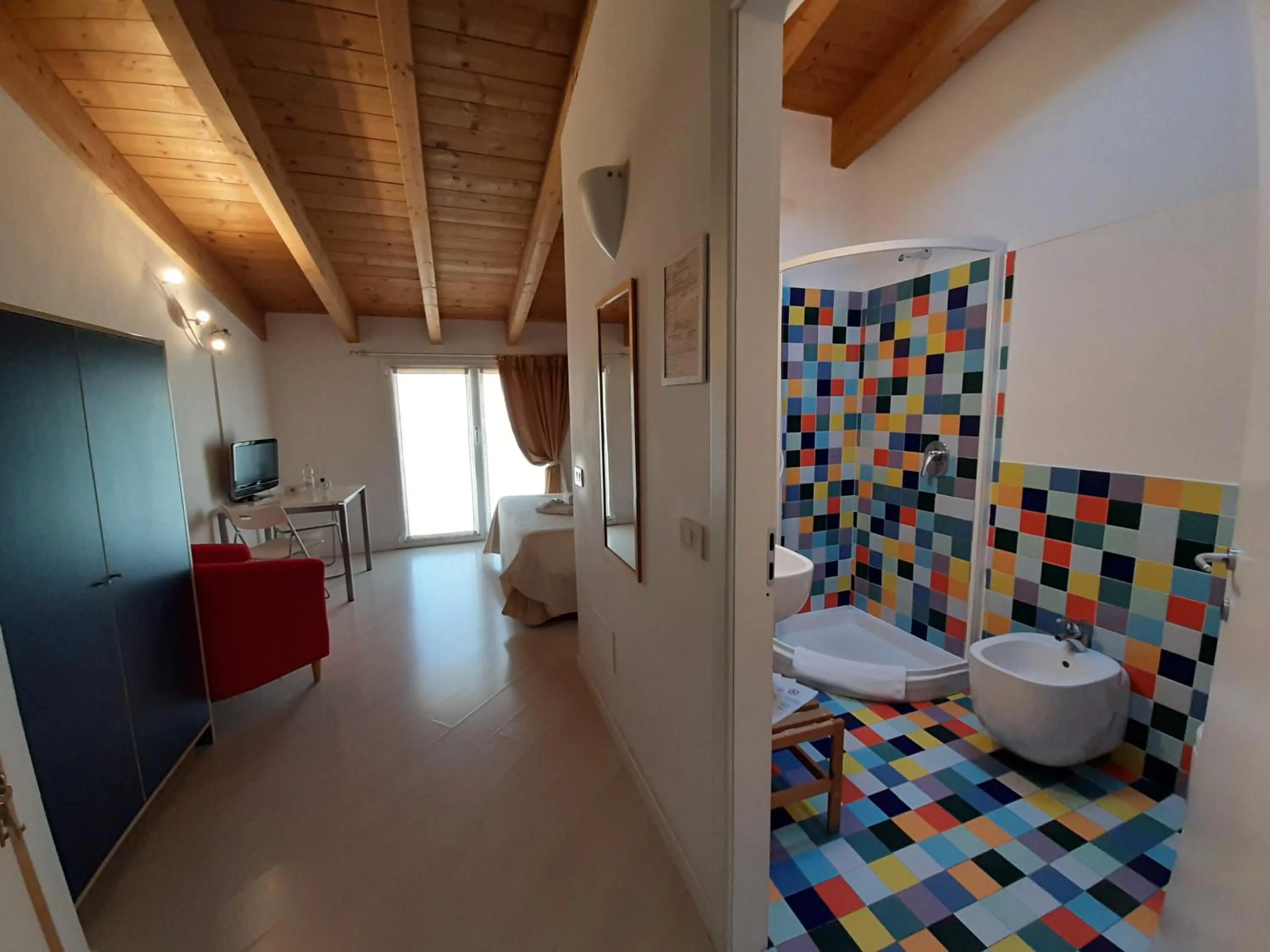 Bed in Il Girasole High Quality Inn