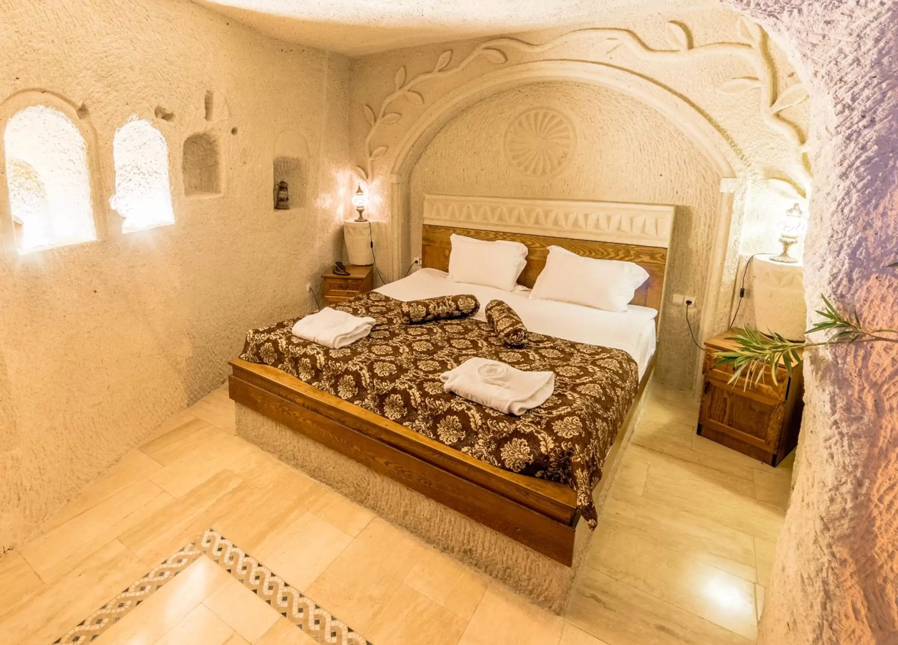 Bed in Elite Cave Suites